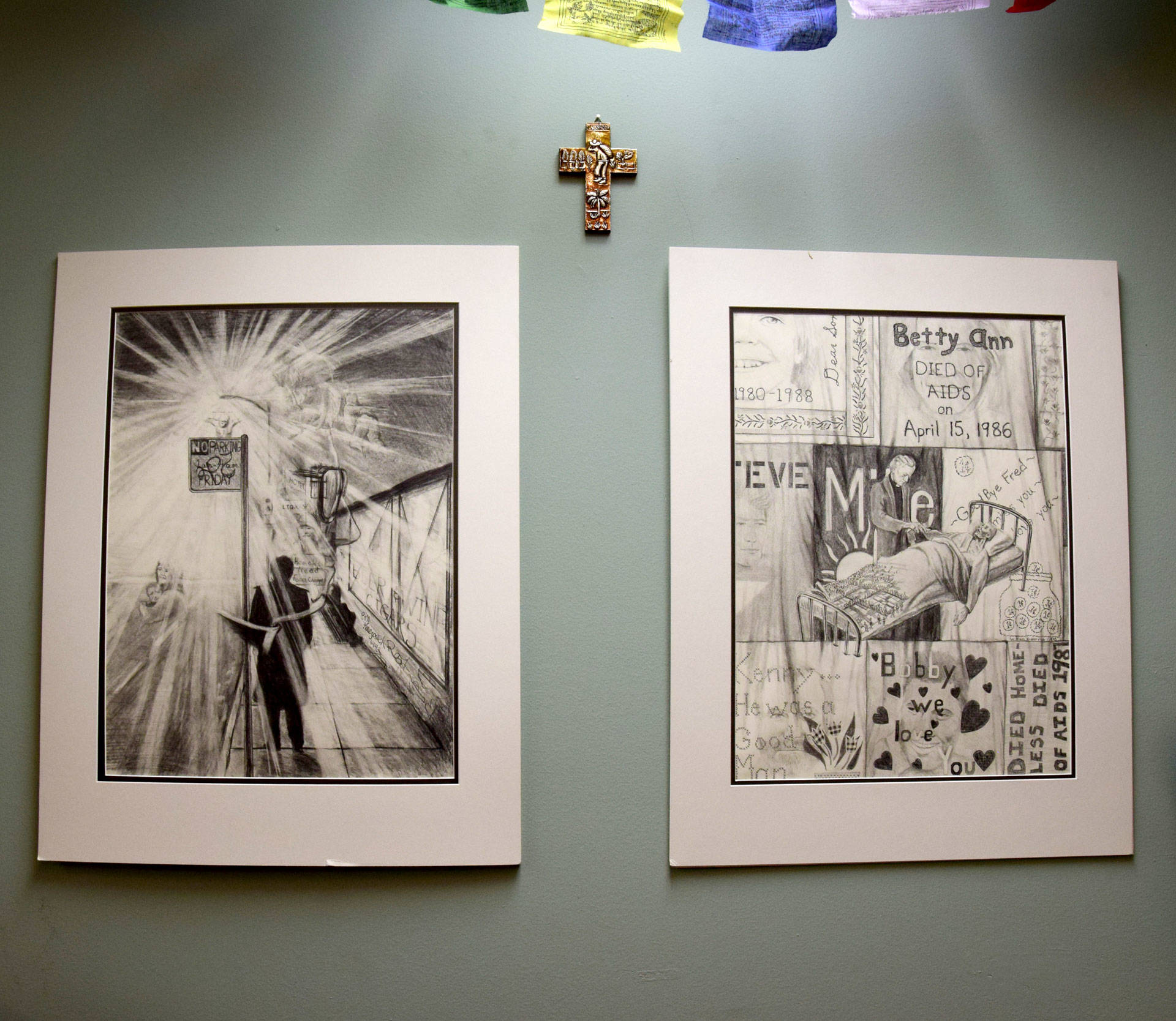 Two drawings hang at the San Francisco Night Ministry's headquarters, where head minister Lyle Beckman led volunteers in prayer before the night's crisis line opened and before he hit the streets.  Natalie Yemenidjian/KQED