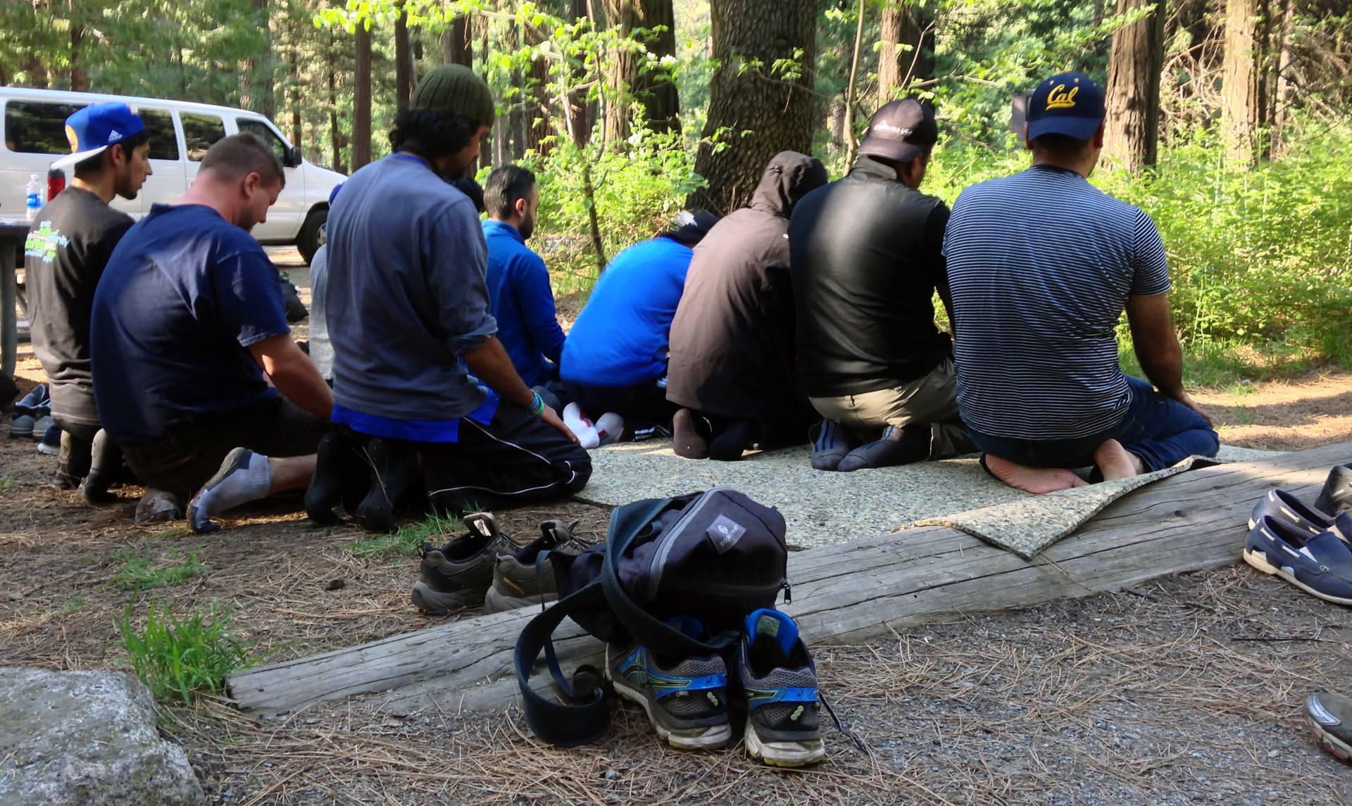Young Muslim men pray at a campsite in Yosemite. Alice Daniel/KQED