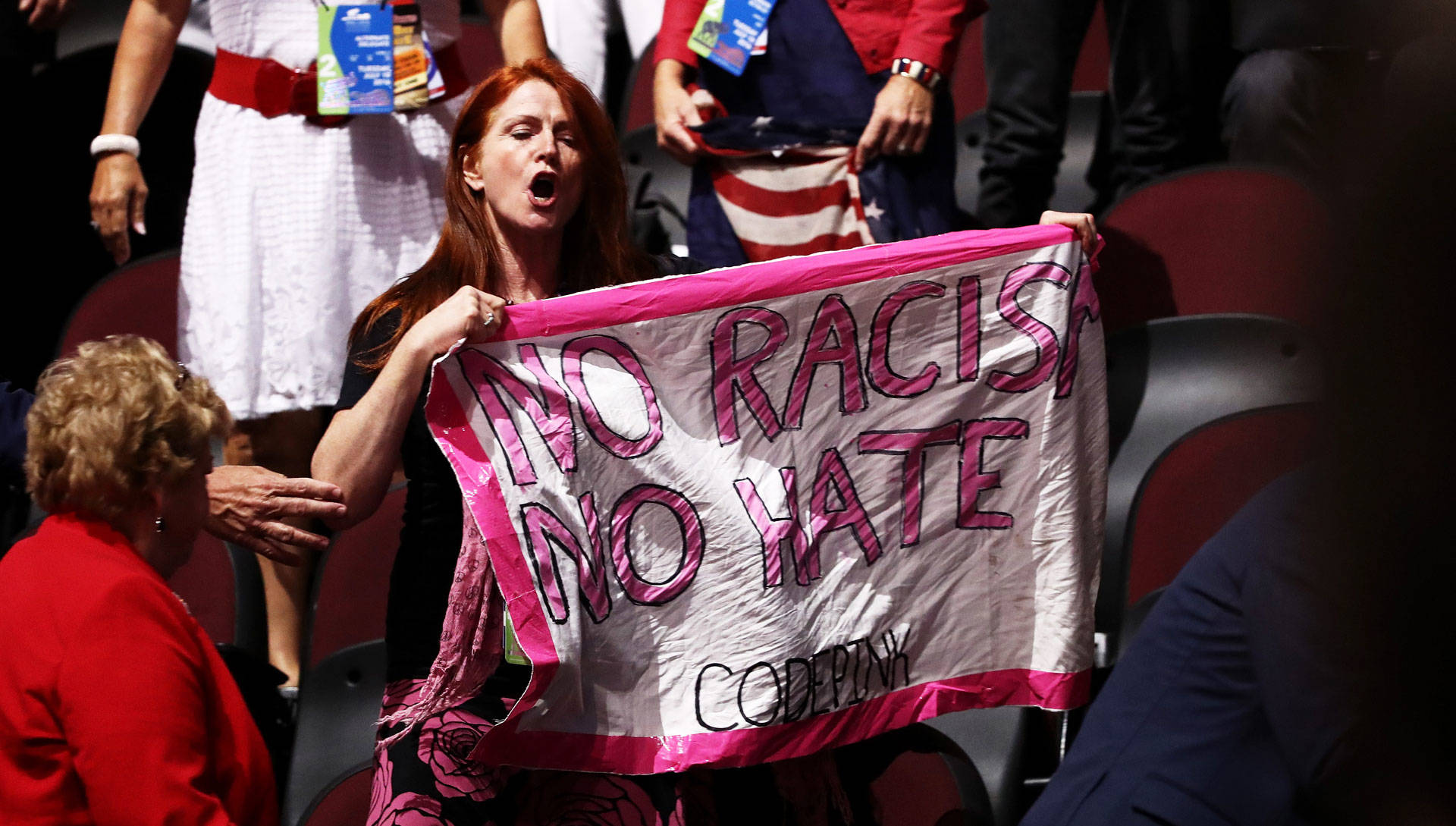 A member of Code Pink demonstrates during former Republican presidential candidate Ben Carson's speech on the second day of the Republican National Convention on July 19, 2016. Win McNamee/Getty Images
