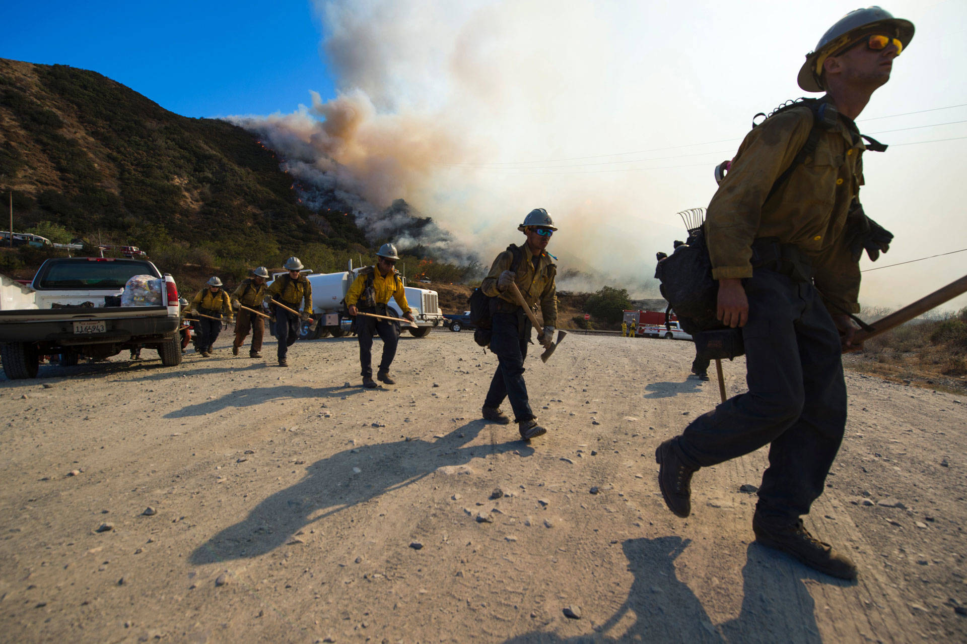 Firefighters prepare to clear a hot spot at the Blue Cut Fire near Wrightwood on Aug. 17, 2016. The blaze destroyed nearly 100 homes and forced the evacuation of 80,000 people in San Bernardino County. Robyn Beck/AFP/Getty Images