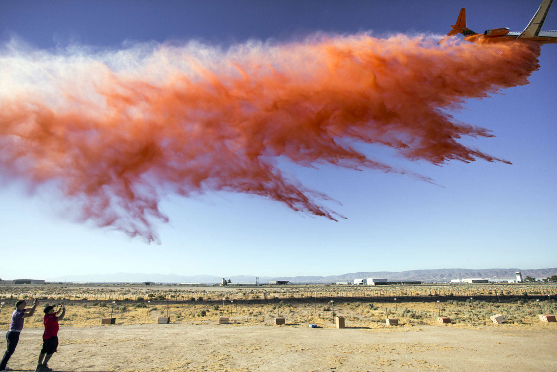 The U.S. Forest Service conducts a fire retardant drop test for a new air tanker at Fox Airfield in Lancaster on July 8, 2016. Maya Sugarman/KPCC