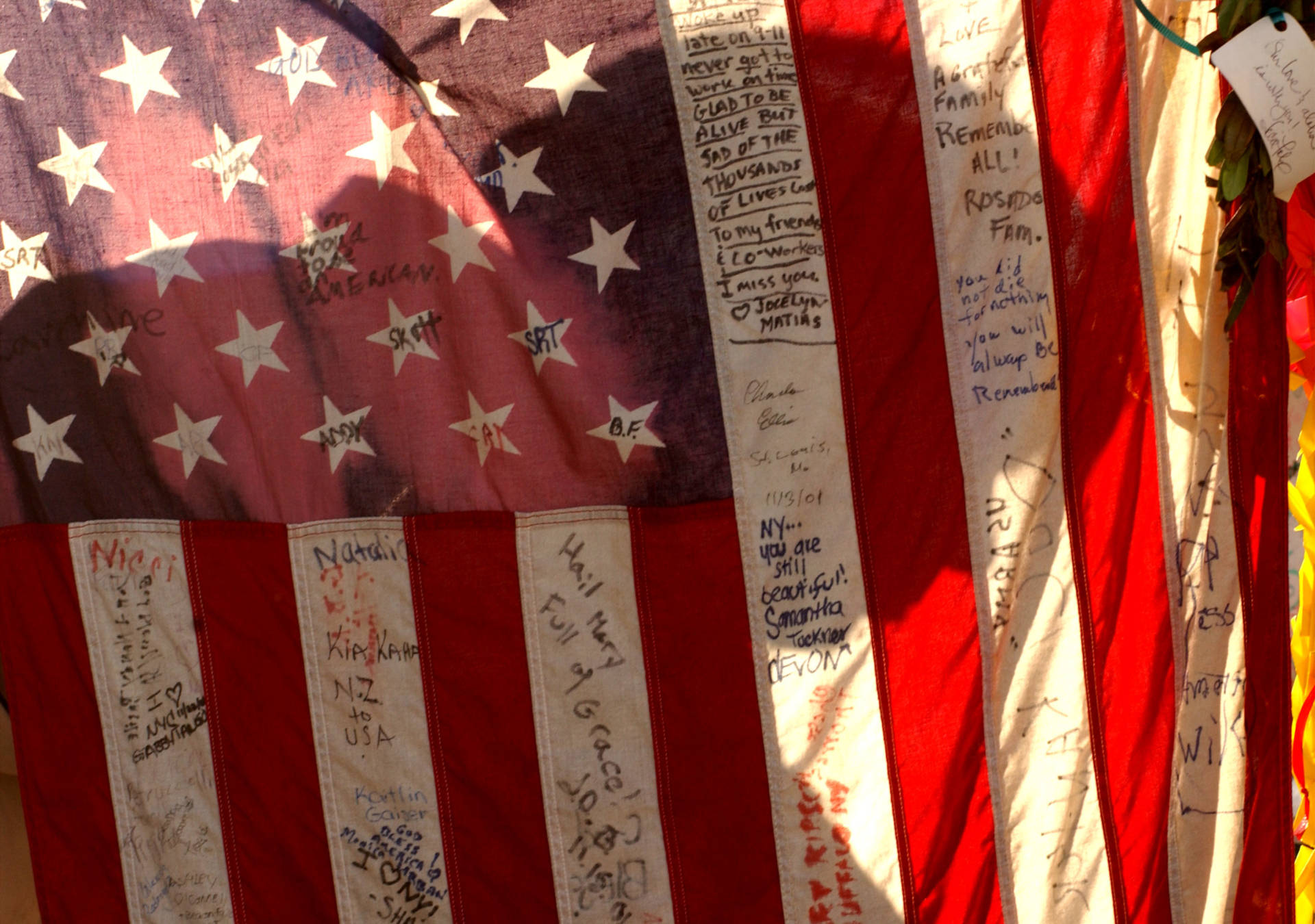 A man's shadow is cast on a flag in 2001 at a 9/11 victims' memorial near the site of the World Trade Center in New York City. Spencer Platt/Getty Images