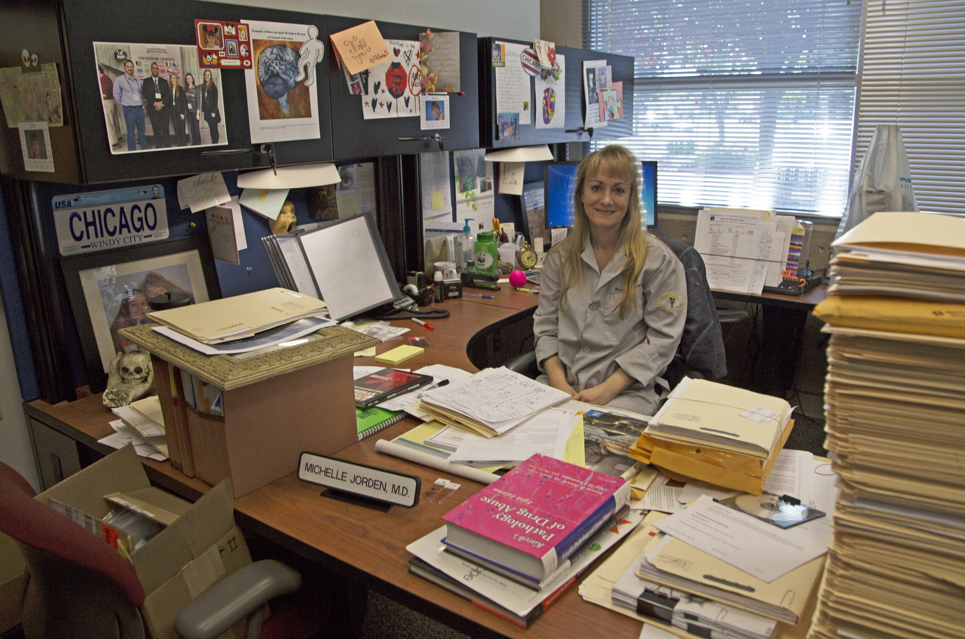 Reports are stacked high on the desk of Assistant Medical Examiner
Michelle Jorden. The medical examiner¹s office in Santa Clara County handles more than 4,000
cases a year. Lisa Pickoff-White/KQED