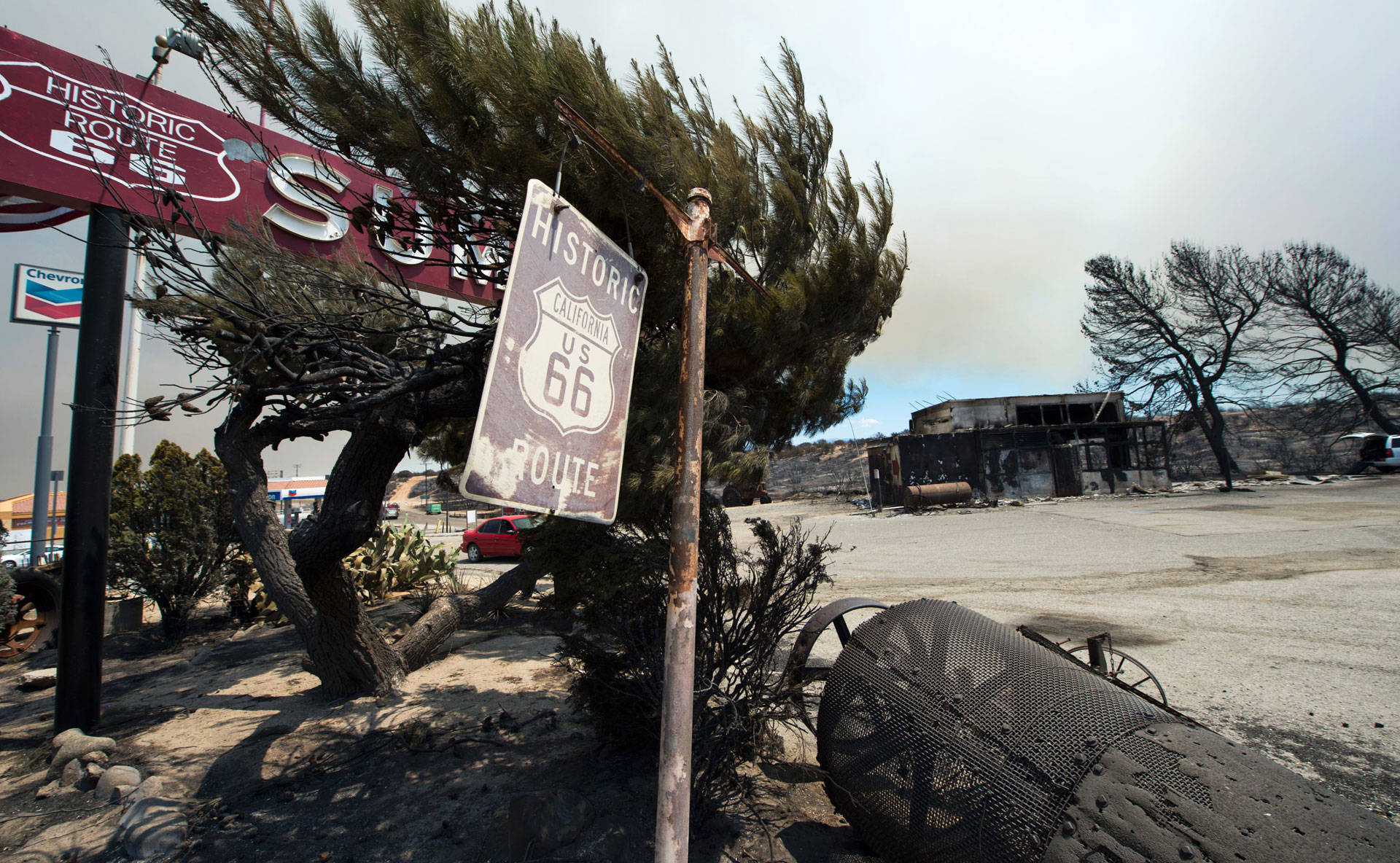 A Route 66 sign is one of the only things still standing after the Blue Cut Fire burned the historic Summit Inn diner to the ground. ROBYN BECK/AFP/Getty Images