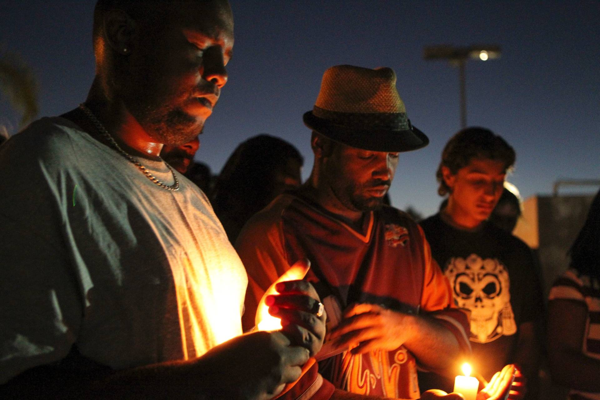 Mourners and activists hold a candlelight vigil during a rally in El Cajon, a suburb of San Diego, Calif., on Wednesday, in protest of the police shooting the day before. Bill Wechter/AFP/Getty Images