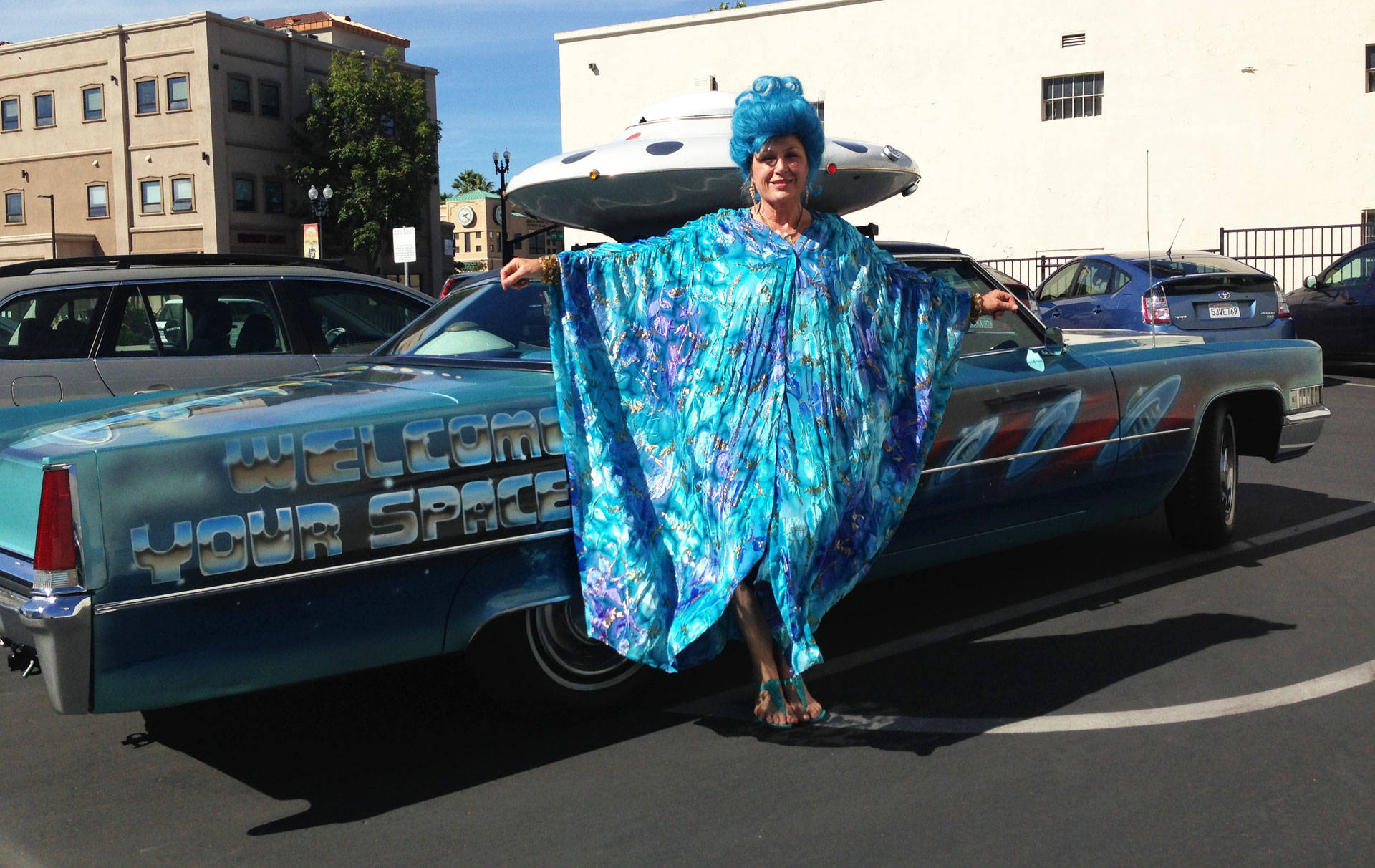 Unarian Lani Calvert with the Academy's '69 Cadillac, modified with a custom saucer. Peter Gilstrap/KQED