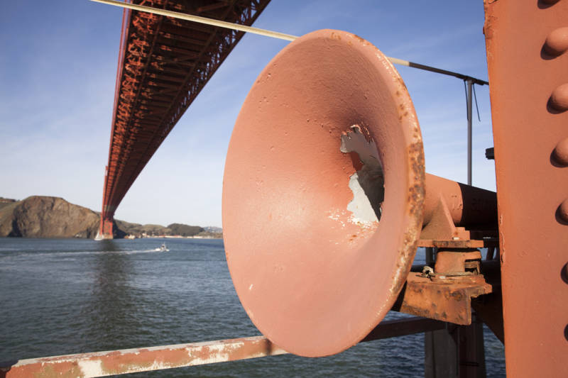 This Golden Gate Bridge fog horn points west on the concrete base of the bridge's south tower, guiding ships safely in the fog.