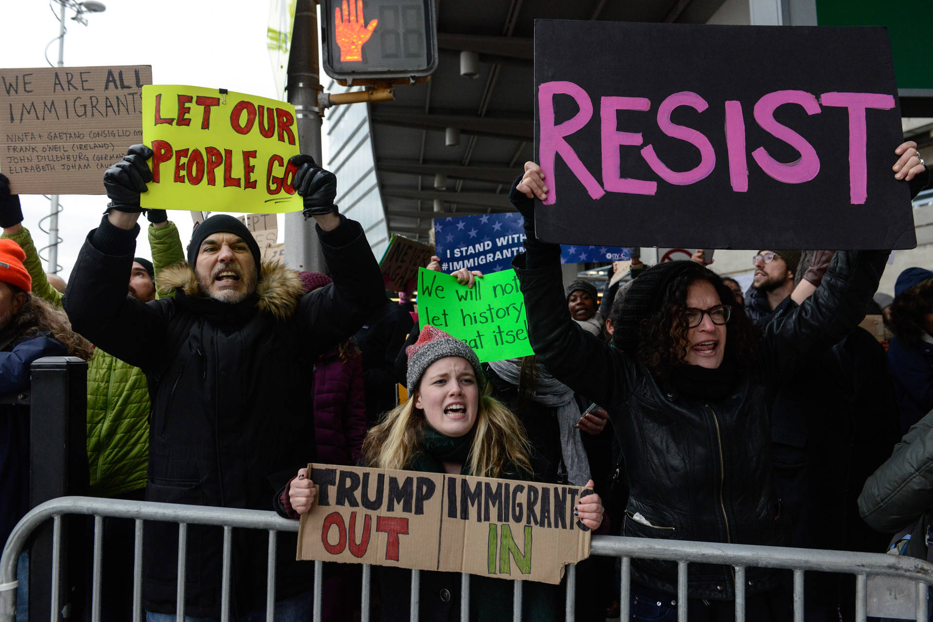 Protesters rally during a demonstration against the Muslim immigration ban at John F. Kennedy International Airport on January 28, 2017 in New York City. President Trump signed the controversial executive order that halted refugees and residents from predominantly Muslim countries from entering the United States. Photo by Stephanie Keith/Getty Images