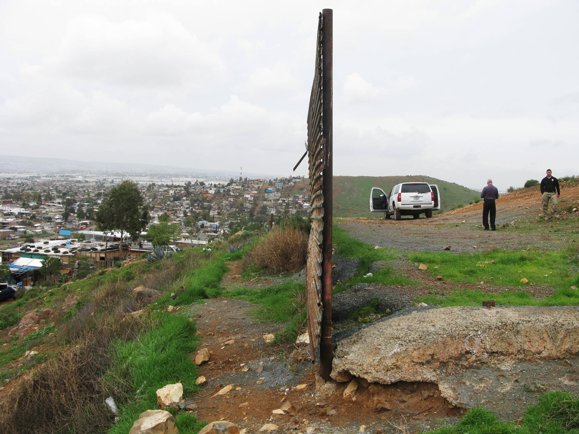 This fence, made of circa-Vietnam War era surplus landing mats, ends at Otay Mesa about 15 miles east of the Pacific Ocean. Tijuana is on the left and California on the right. There are two other kinds of fencing along the U.S.-Mexico border: steel mesh and concrete-filled steel beams. John Burnett/NPR