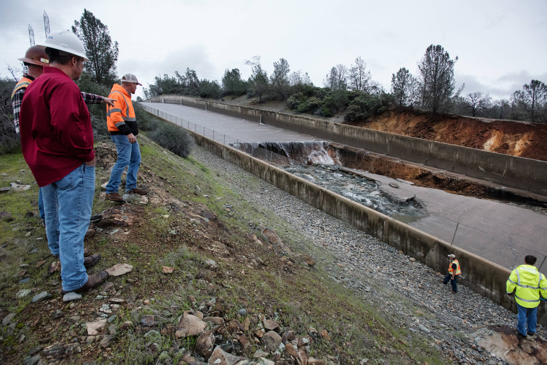 California Department of Water Resources workers inspected damage to the spillway at Oroville Dam after a breach appeared on Feb. 7, 2017. Kelly M. Grow/DWR