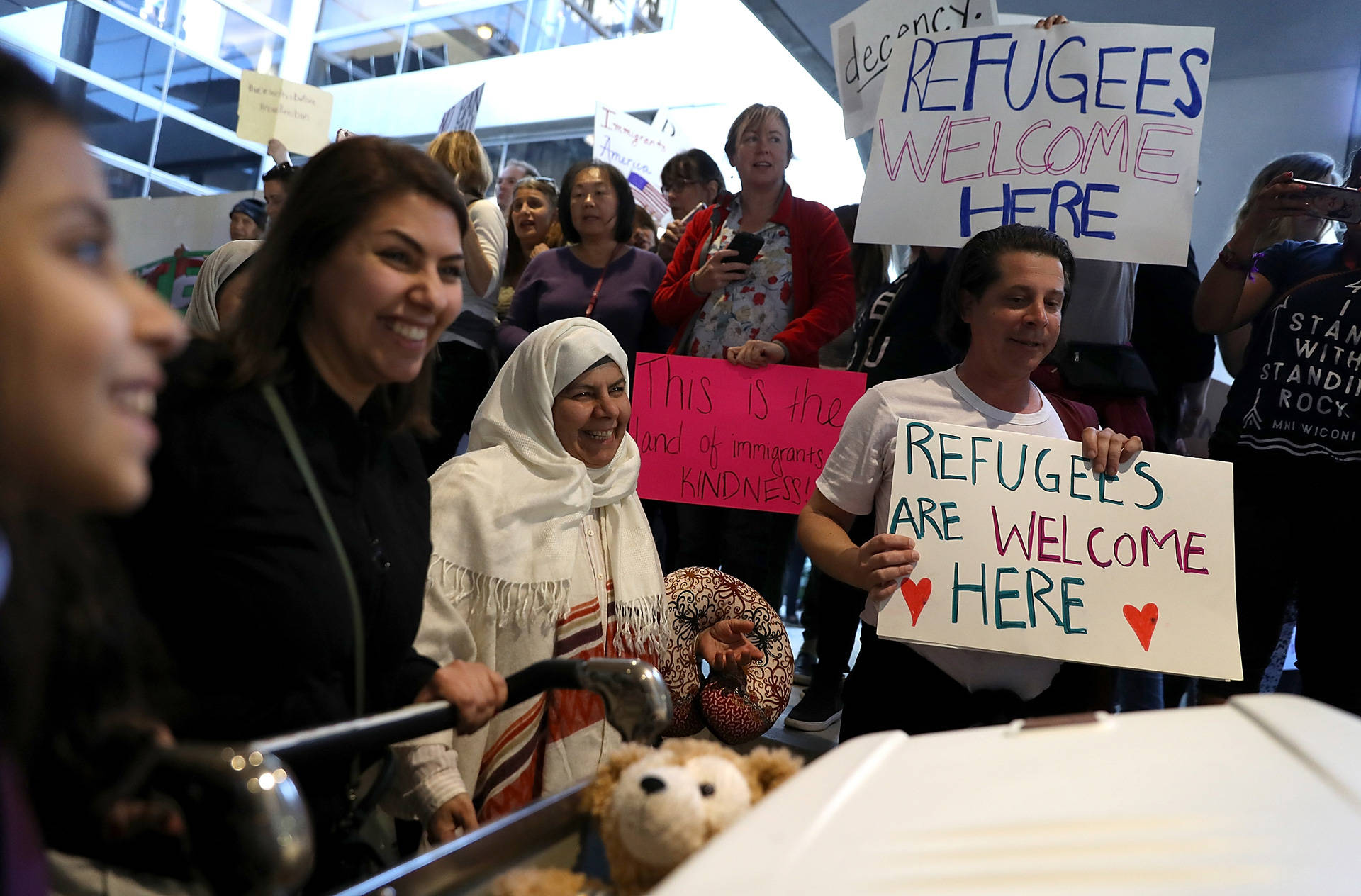 International travelers are welcomed on Jan. 29, 2017, by protesters at LAX holding signs during a demonstration against the immigration ban that was imposed by President Donald Trump. Justin Sullivan/Getty Images