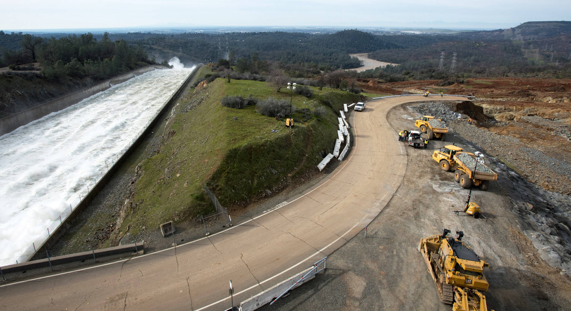 The state Department of Water Resources continues to release 100,000 cubic feet per second (cfs) of water from the primary Oroville Spillway, while crews inspect and evaluate the erosion just below the emergency spillway site on Monday, Feb. 13. Kelly M. Grow/ California Department of Water