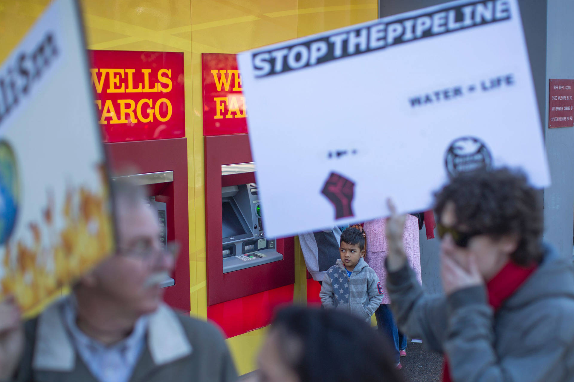 Supporters of the Standing Rock Water Protectors call on banks to divest from the Dakota Access Pipeline in a protest outside a Wells Fargo branch in Los Angeles on Dec. 16, 2016. David McNew/AFP/Getty Images