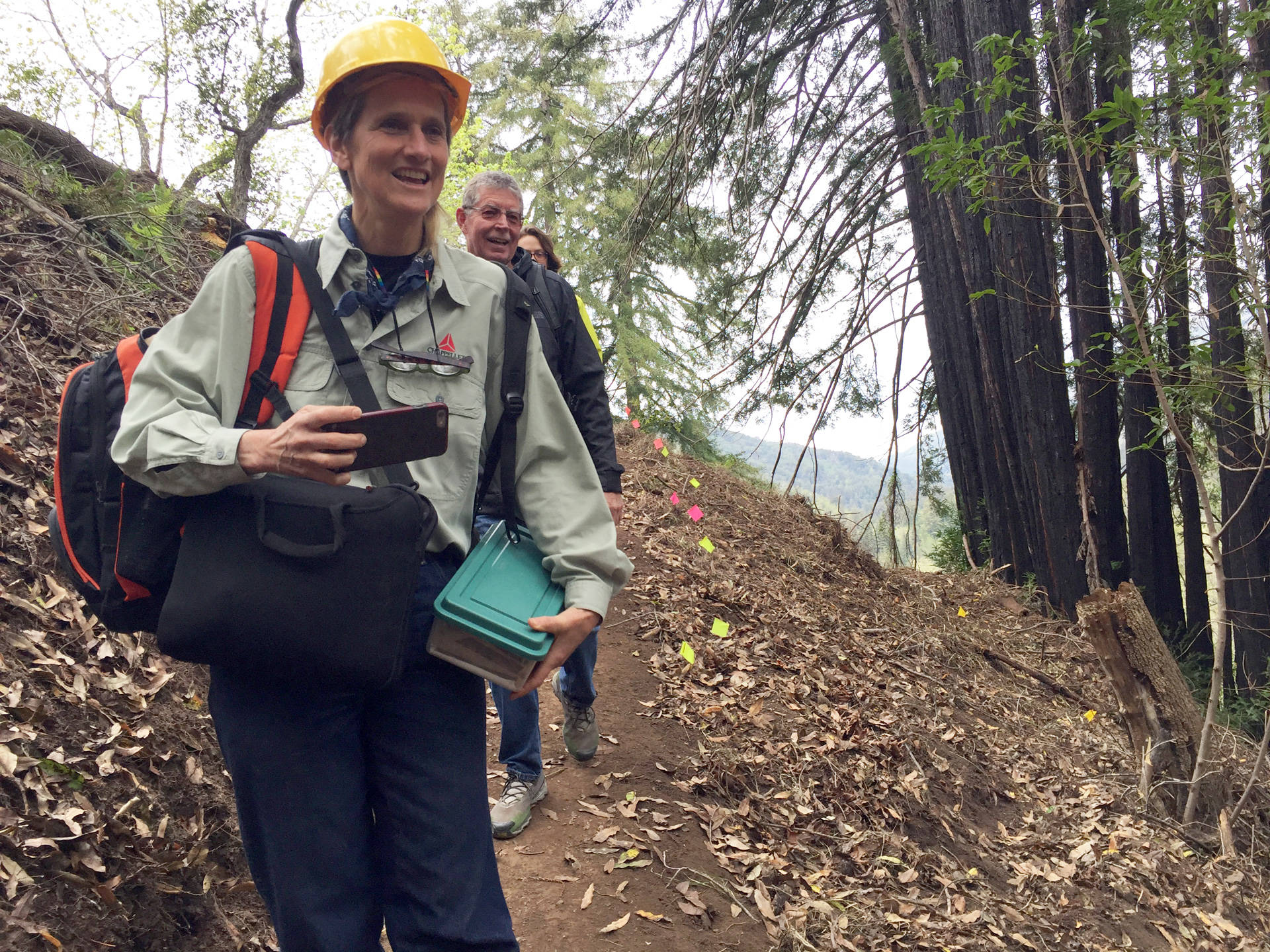 Big Sur locals Carissa Chappellet and Butch Kronlund check out progress on the trail.
 Krista Almanzan/KQED
