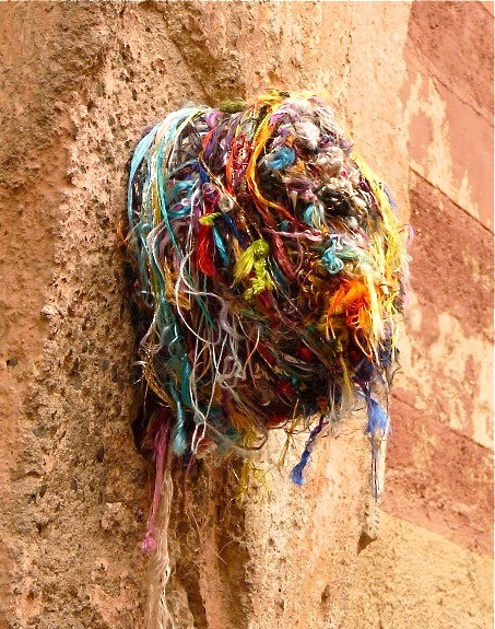 These colorful bundles of thread can be found on the walls of back alleys in Morocco in cities like Marrakesh and Fez.