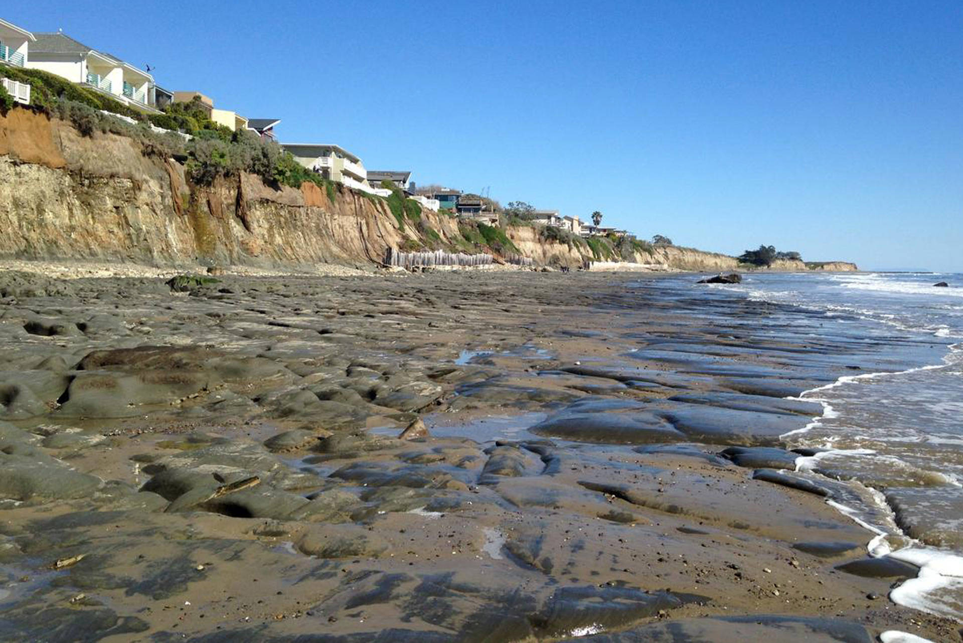 Bedrock is exposed at low tide along the beach at Isla Vista.  Alex Snyder/USGS