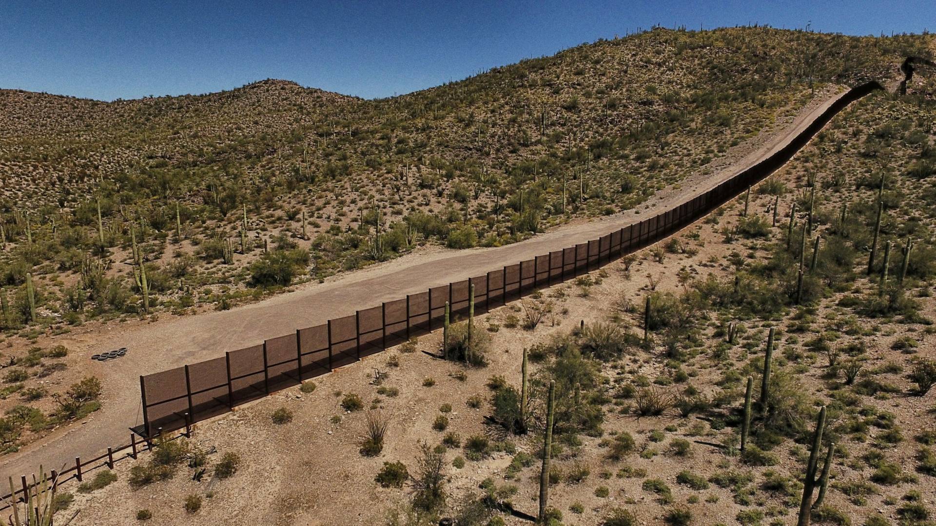 The metal fence along the border between Sonoyta, Mexico, and the Arizona desert in the United States. Pedro Pardo/AFP/Getty Images