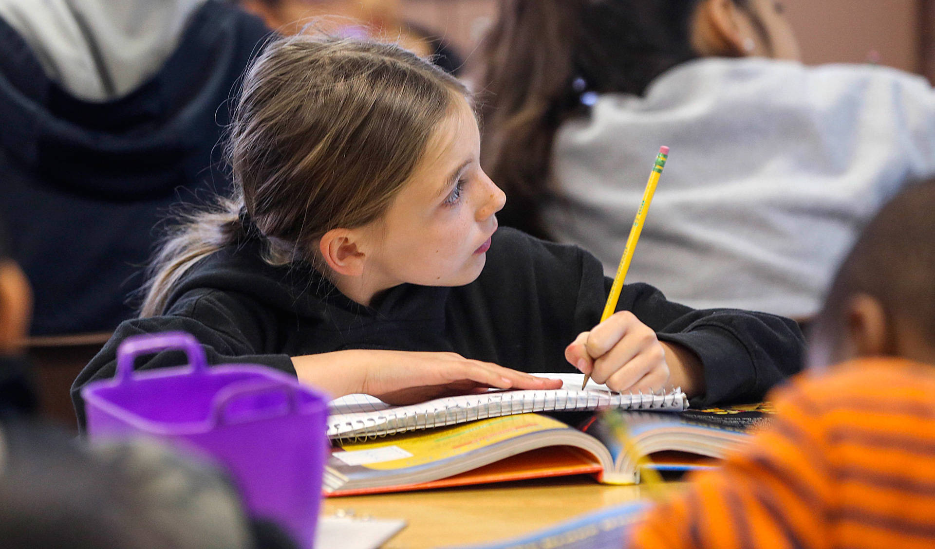 A Greenfield Union student takes notes during class at Kendrick Elementary School in Bakersfield. The district is one of 15 CALmatters studied to understand how well the state’s new school funding formula is working. Henry Barrios/The Californian