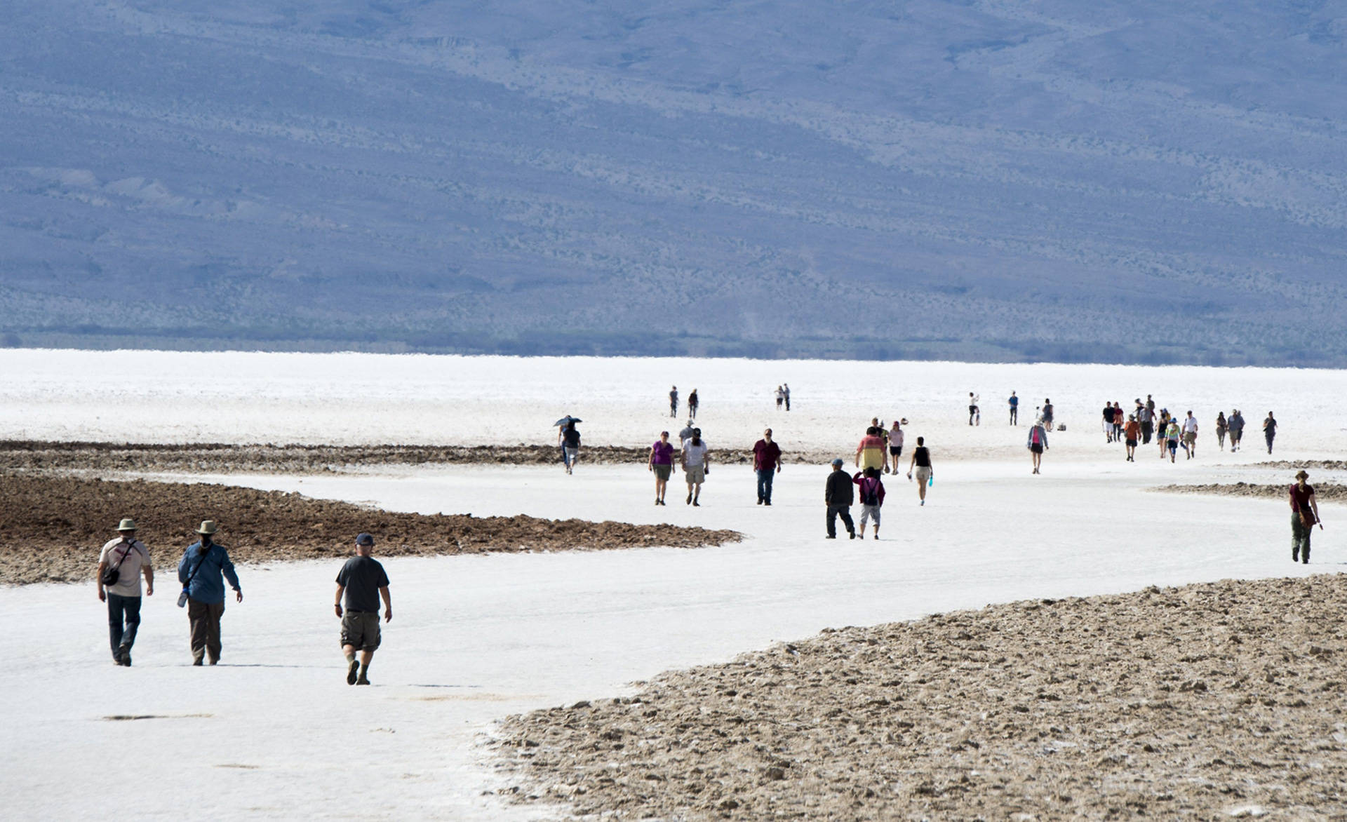 Tourists walk on the salt pan at Badwater Basin in Death Valley National Park. ROBYN BECK/AFP/Getty Images