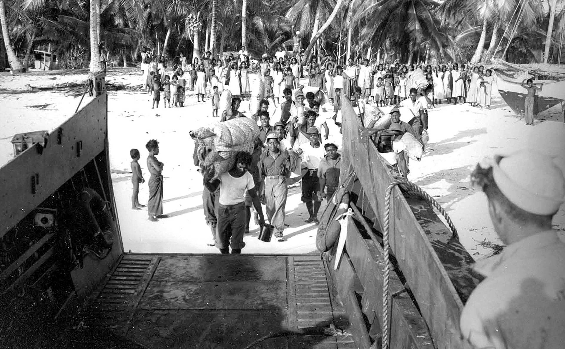 Marshallese evacuate from their island of Bikini in 1946, in advance of nuclear weapons testing. National Security Archives