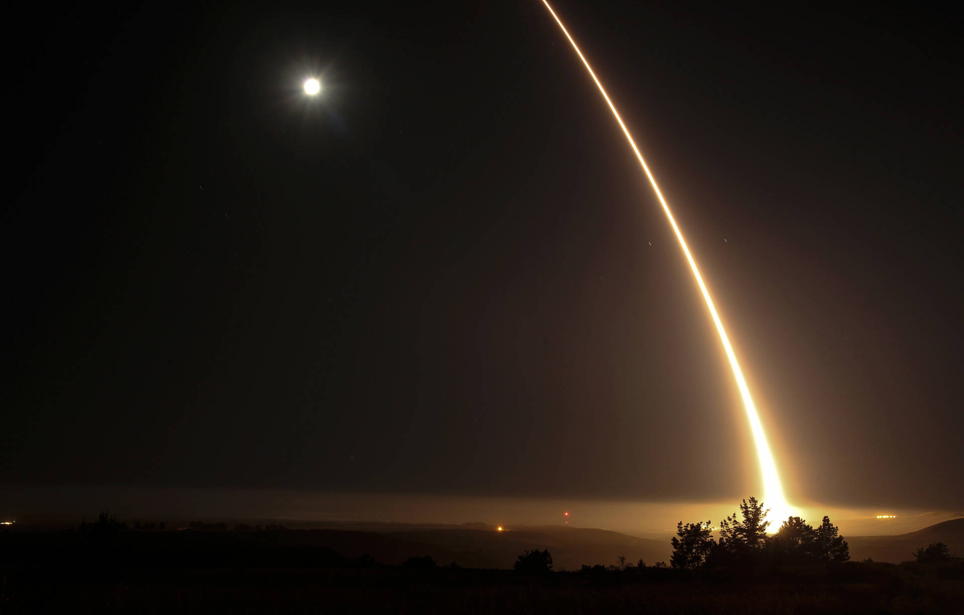 A streak of light trails off into the night sky during a test firing of an unarmed ICBM at Vandenberg Air Force Base early on May 3, 2017. The upcoming test will be the fourth such test this year. RINGO CHIU/AFP/Getty Images