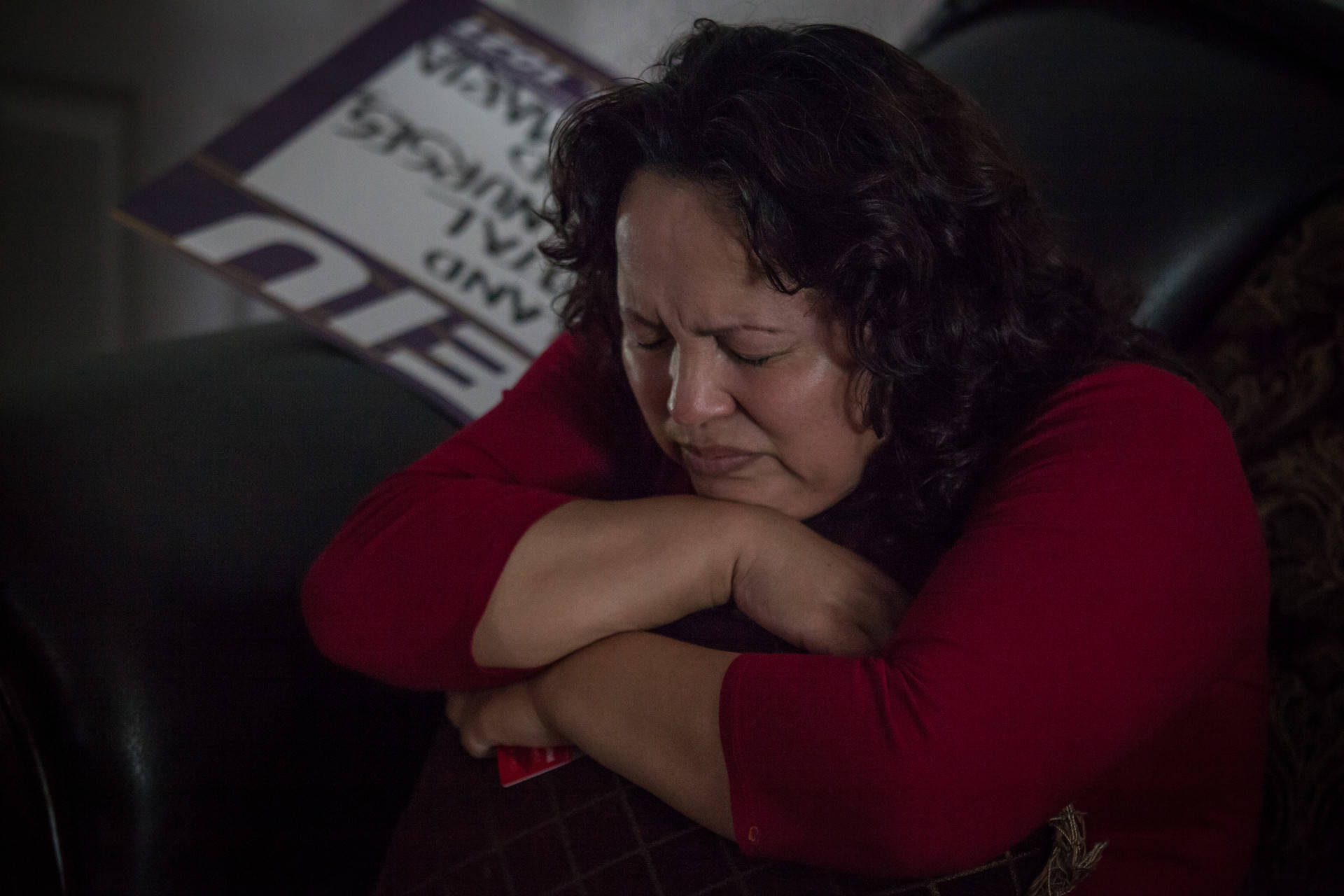 Maria Mendoza-Sanchez clutches a pillow in her Oakland home on Wednesday, Aug. 16, 2017, hours before she, her husband and their son left the U.S. for Mexico after federal immigration authorities denied their request for a reprieve.  Deborah Svoboda/KQED