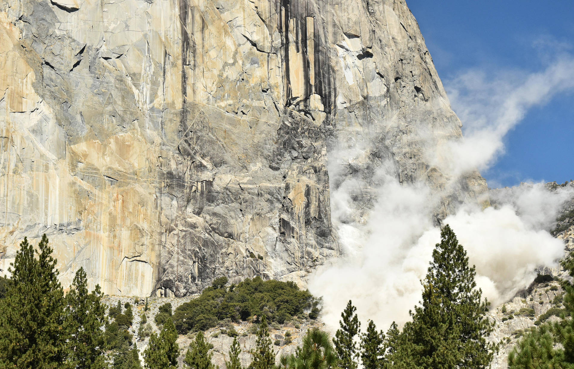 Dust rises from the base of El Capitan following Wednesday's deadly rockfall. Courtesy Tom Evans