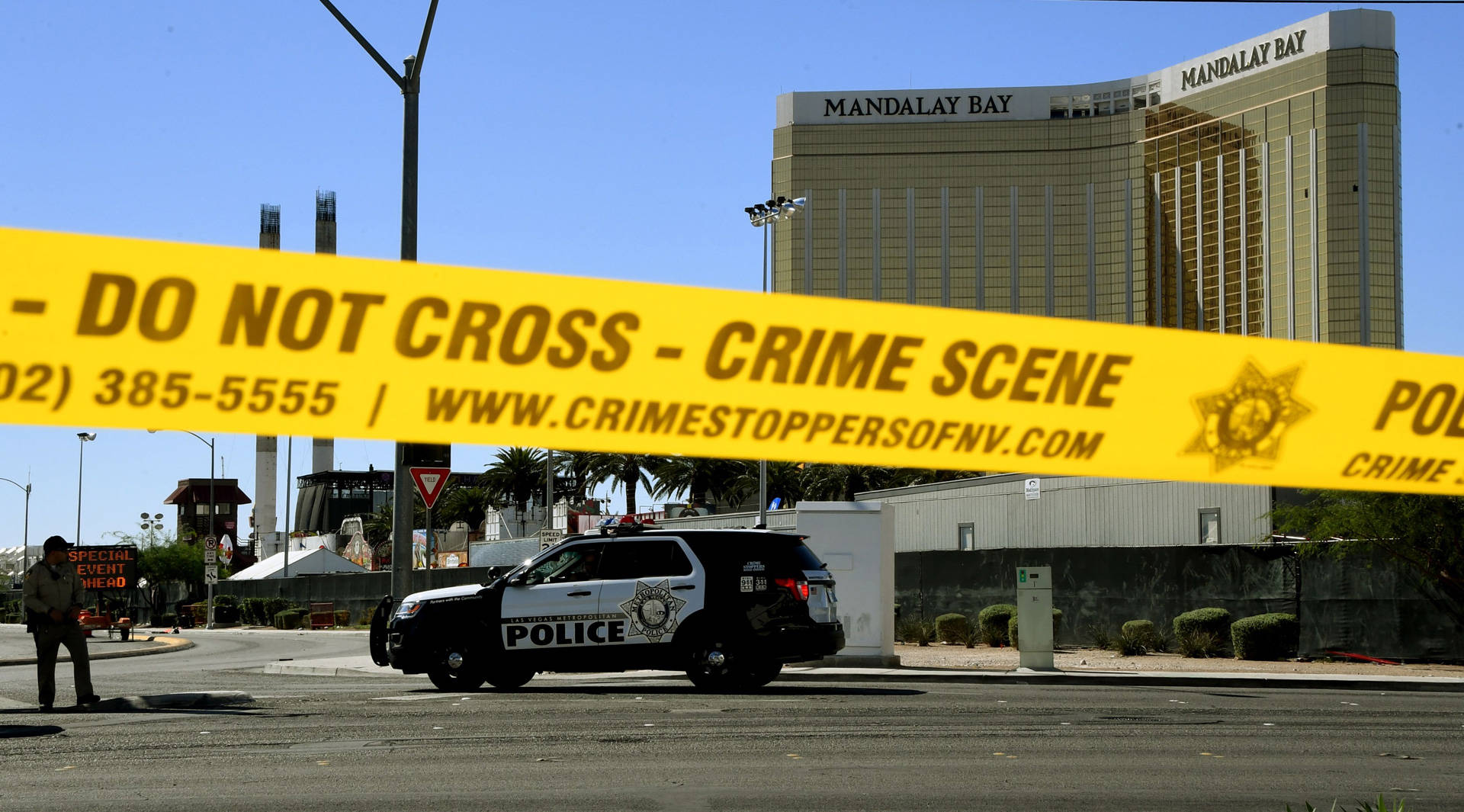 Crime scene tape surrounds the Mandalay Bay Hotel in Las Vegas, from which 64-year-old Stephen Paddock shot and killed at least 58 people and wounded more than 500 others Sunday night. Damage to the shooter's 32nd-floor window can be seen at top right. MARK RALSTON/AFP/Getty Images