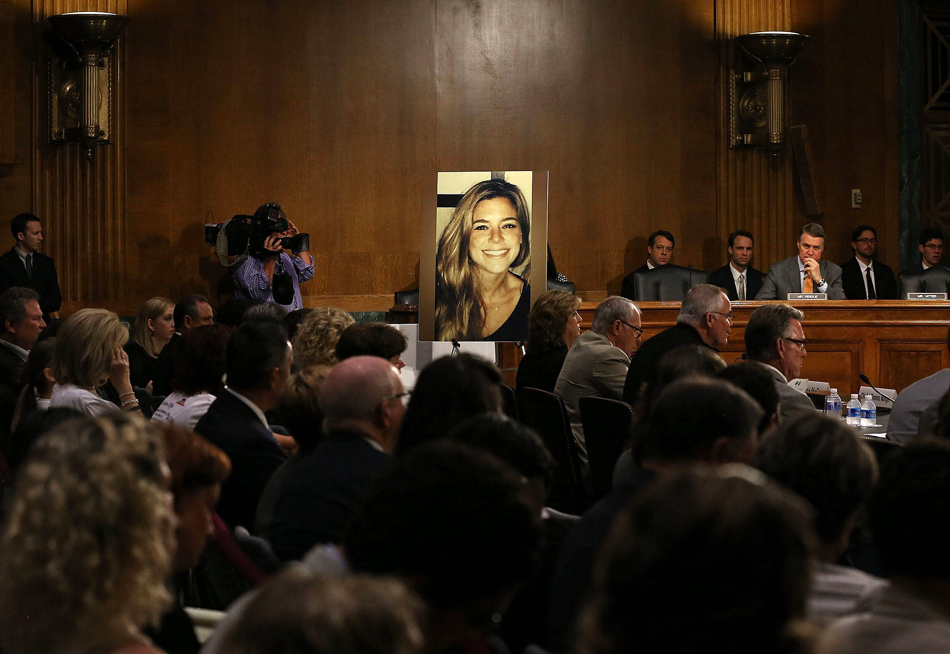 A large photo of Kathryn Steinle is shown while her dad, James Steinle, testifies during a Senate Judiciary Committee hearing on Capitol Hill, July 21, 2015, in Washington, D.C. The committee heard testimony from family members who have had loved ones killed by undocumented immigrants. Mark Wilson/Getty Images