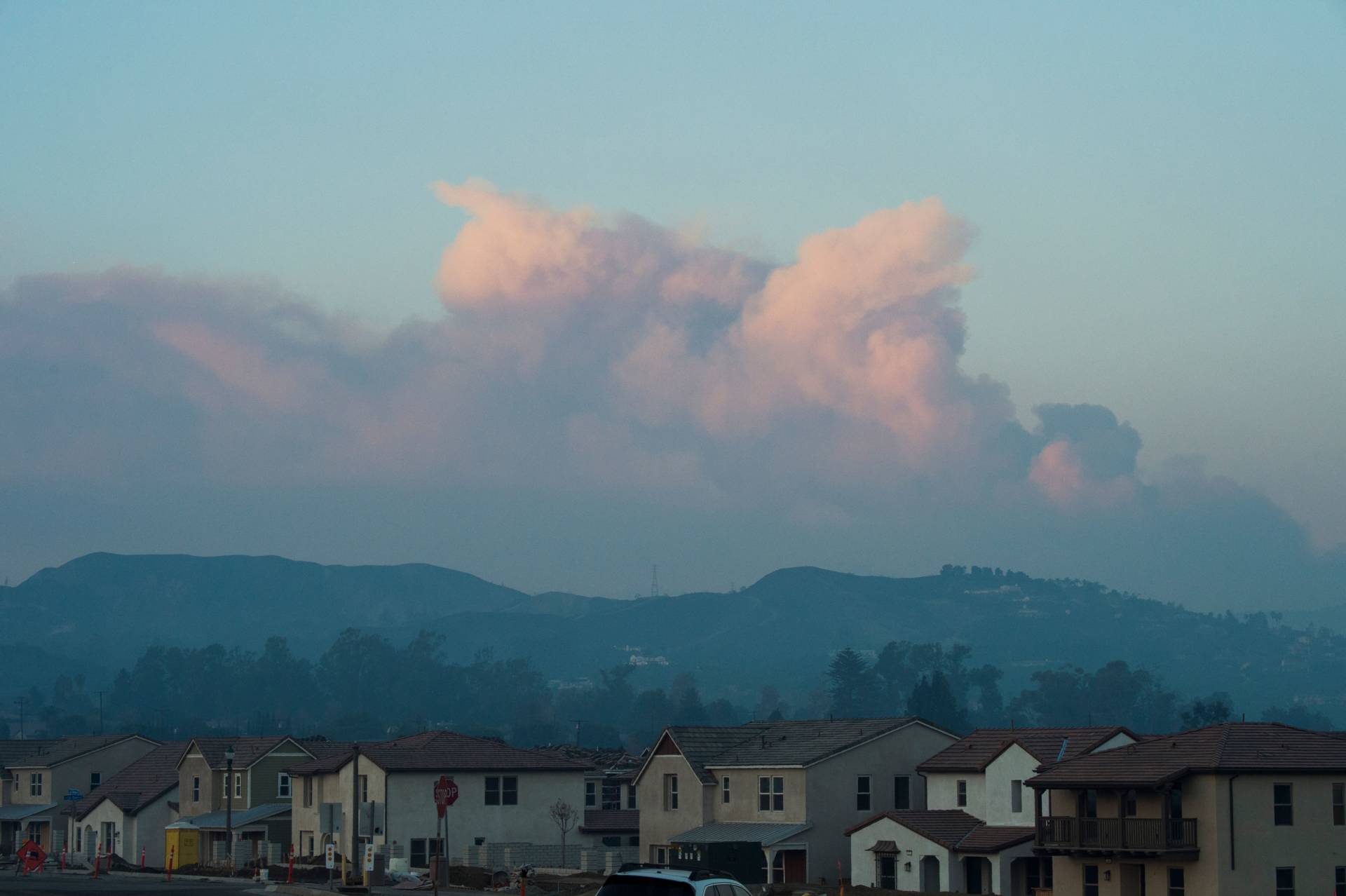 Smoke from the Thomas Fire is seen from Santa Paula, California, as it rises over Ventura and Santa Barbara counties, Dec. 12, 2017. The Thomas Fire, the fifth largest in California history, has burned through 236,000 acres and is 25 percent contained, according to Cal Fire. Robyn Beck/AFP/Getty Images