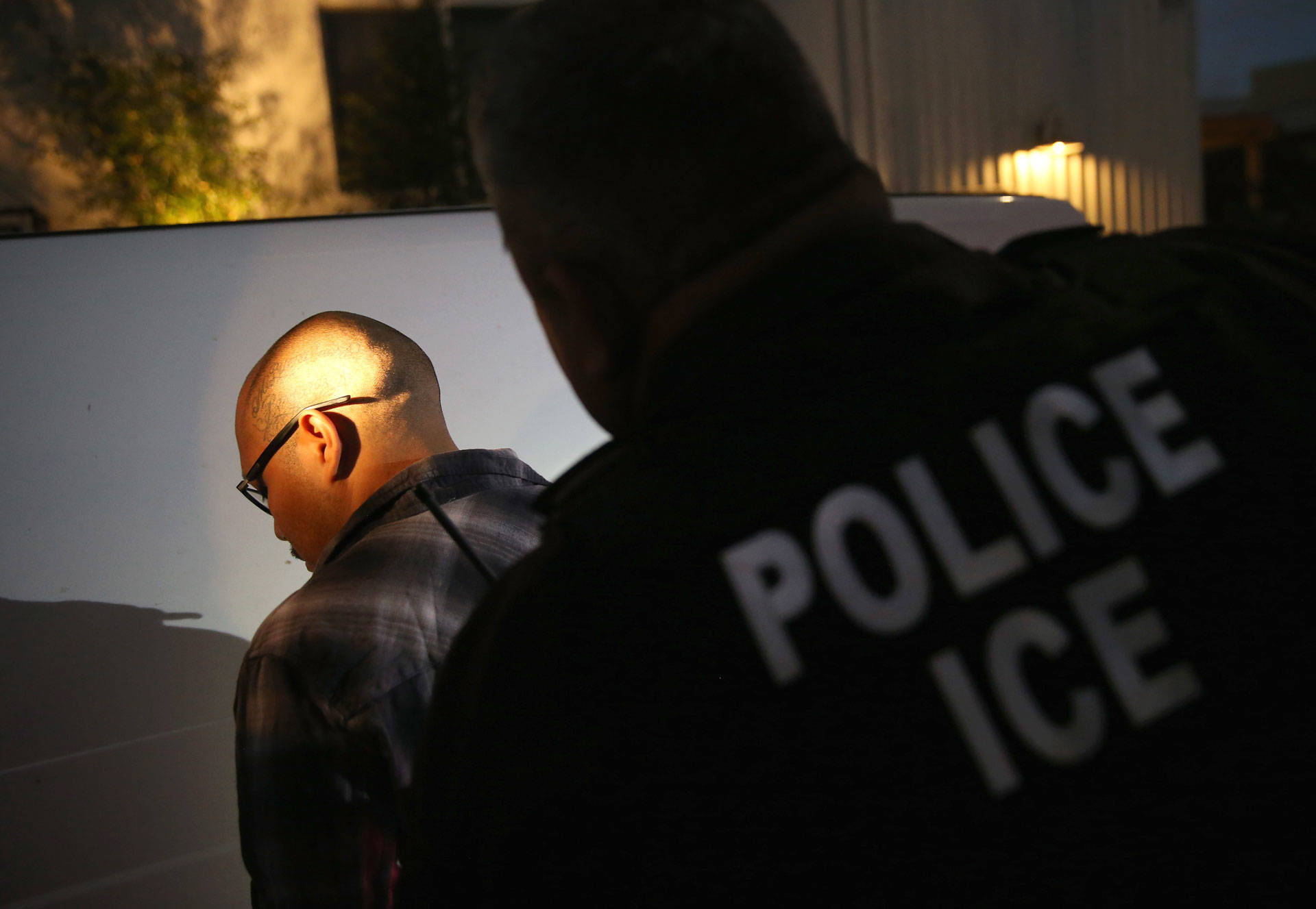 A man is detained by Immigration and Customs Enforcement (ICE) agents in October 2015 in Los Angeles John Moore/Getty Images