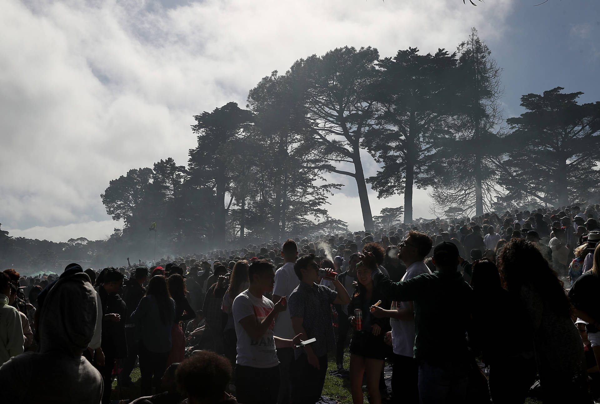 A cloud of marijuana smoke hangs over a crowd during a 420 Day celebration on 'Hippie Hill.' Justin Sullivan/Getty Images