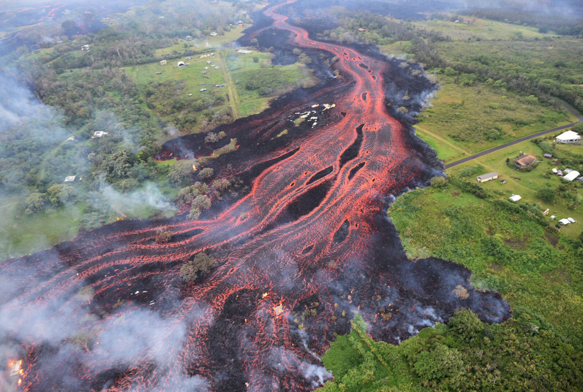 Lava flows from fissures near Pahoa, Hawaii, on Saturday. USGS/AP