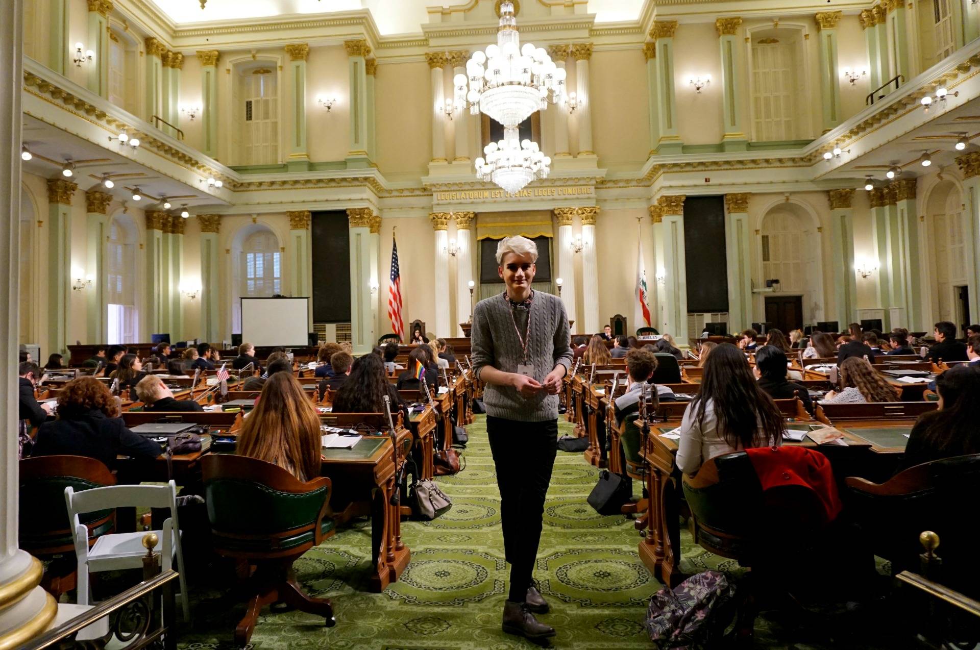 A page passes notes between members of the Assembly. Amanda Font/KQED