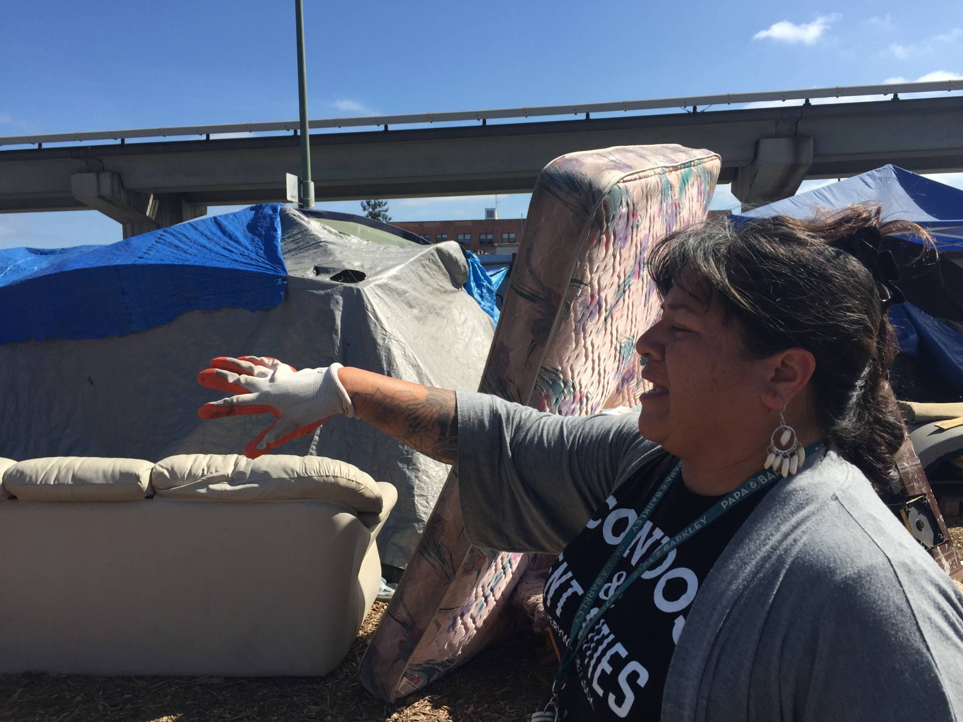 Needa Bee, lead organizer for The Village, at an East Oakland encampment this past summer.  Tara Siler/KQED