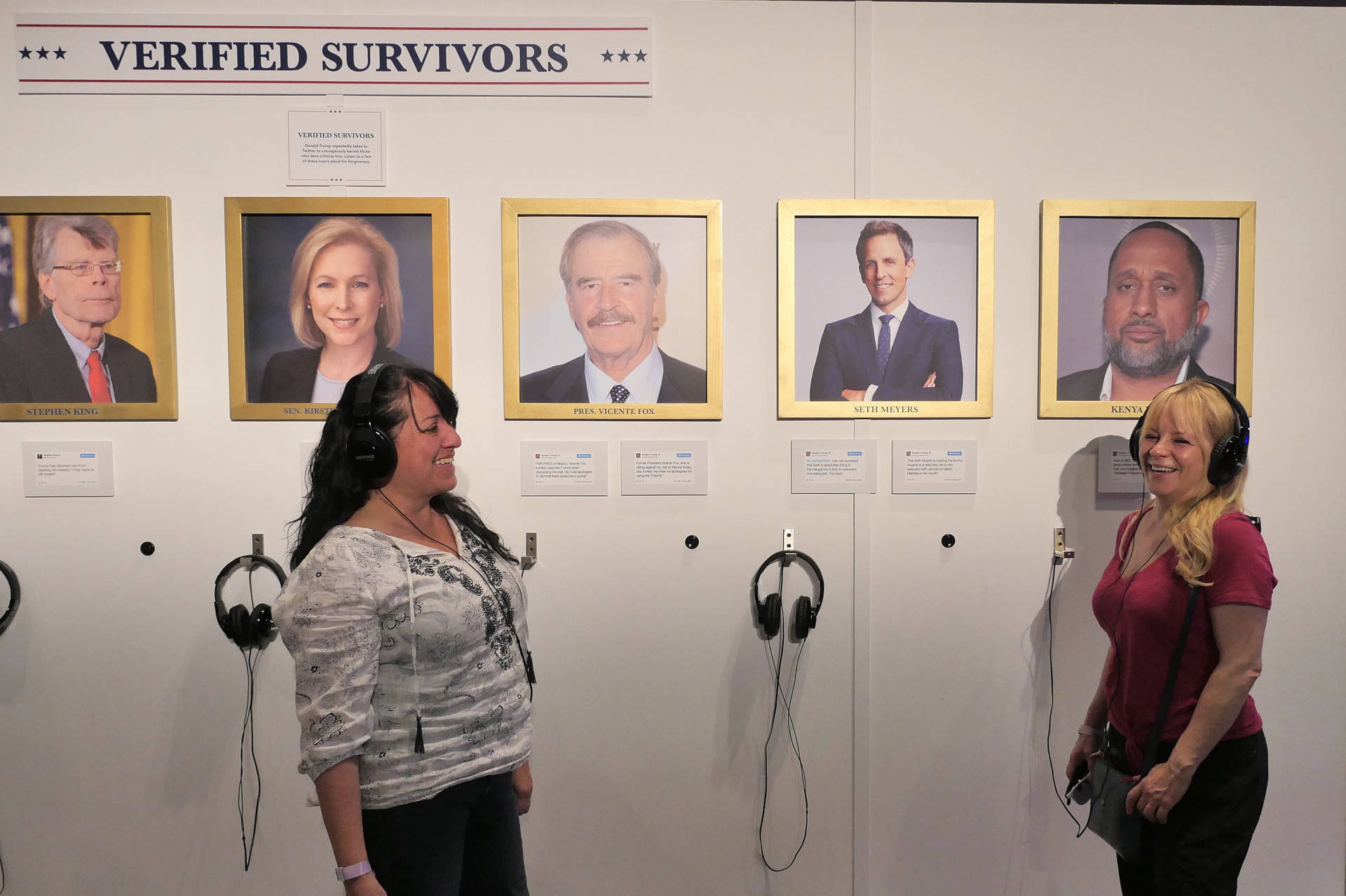 Diana Gaffney, L, and Tina Suca, R, listen to recordings of celebrities and politicians who have battled with President Trump on Twitter and survived at the Donald J. Trump Presidential Twitter Library at Clusterfest in San Francisco. Sheraz Sadiq/KQED