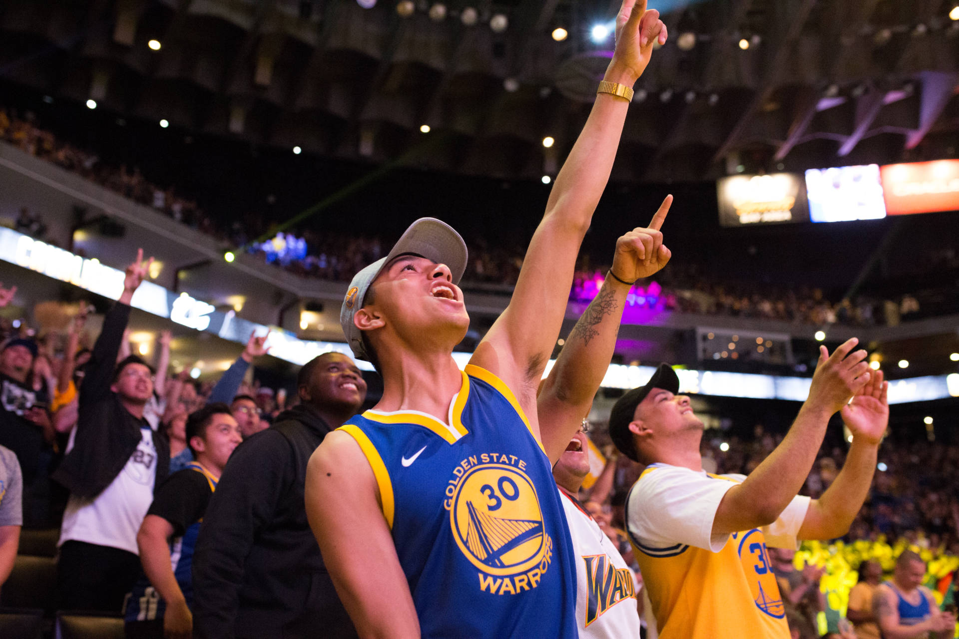 Urias Escudero of San Jose  cheers as the Warriors secure their win over the Cleveland Cavaliers on June 8, 2018 at the Warrior  Watch Party at Oracle Arena in Oakland. Samantha Shanahan/KQED