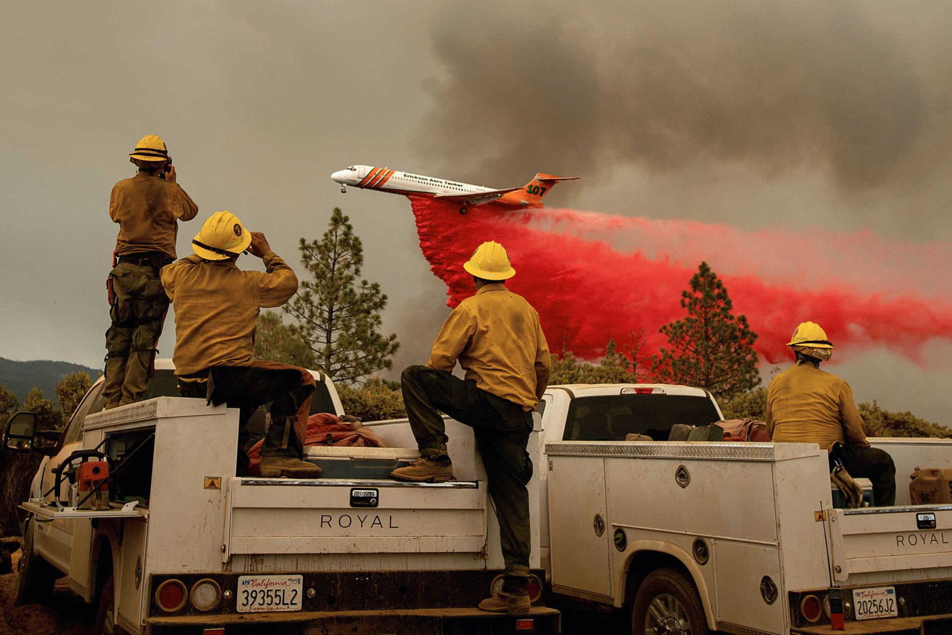 Firefighters watched Saturday (July 21) as an air tanker dropped retardant while battling the Ferguson Fire in the Stanislaus National Forest, near Yosemite National Park. Noah Berger/AFP-Getty Images