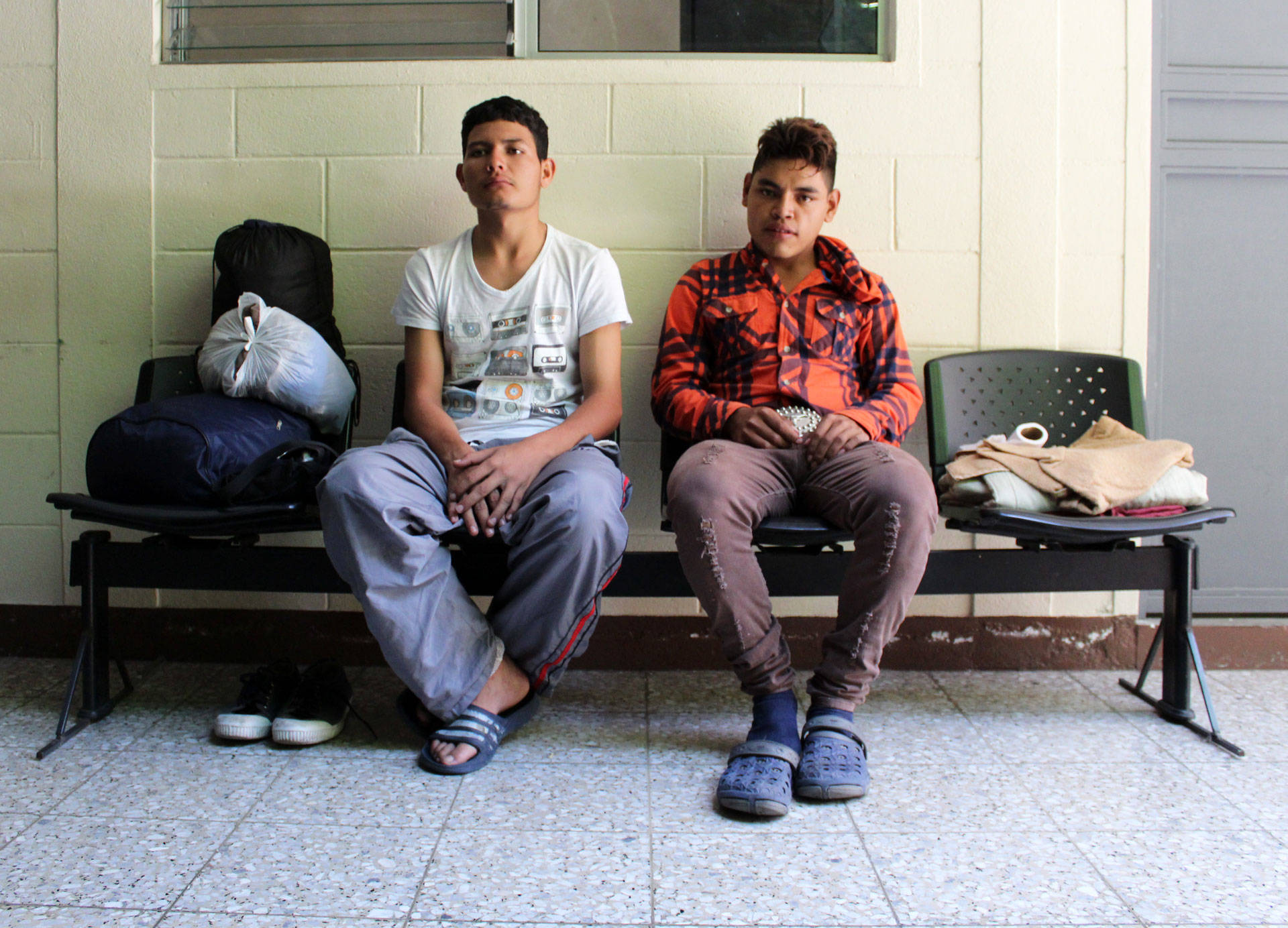 Two men wait for social services in Zona 1, Guatemala City. John Sepulvado/KQED