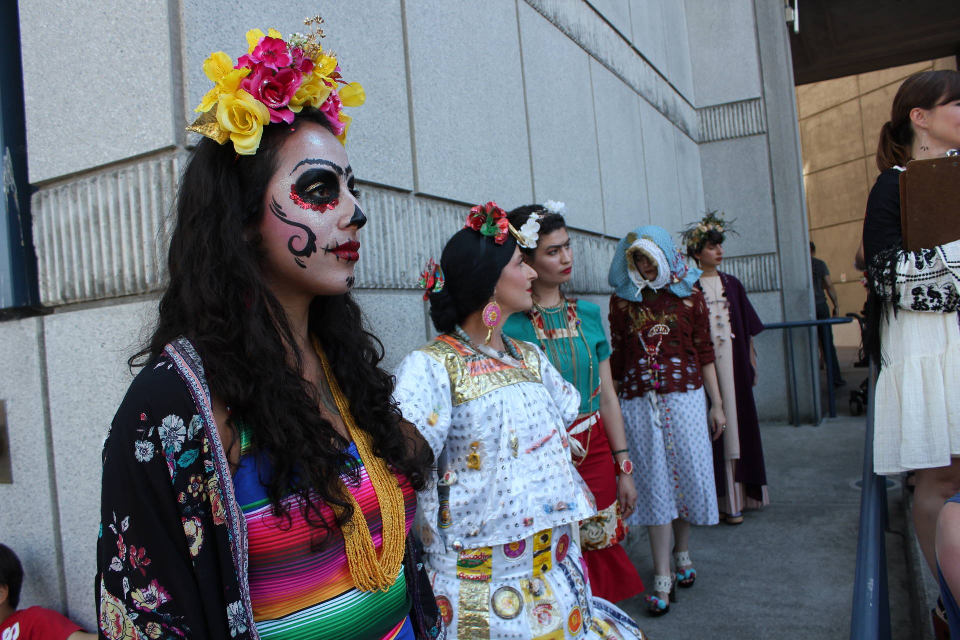 Gloria Magaña of Modesto waits to walk the Frida Kahlo fashion show runway outside the Bedford Gallery in Walnut Creek. Of Kahlo, she said, "She's weird, and I like it." Sara Hossaini/KQED