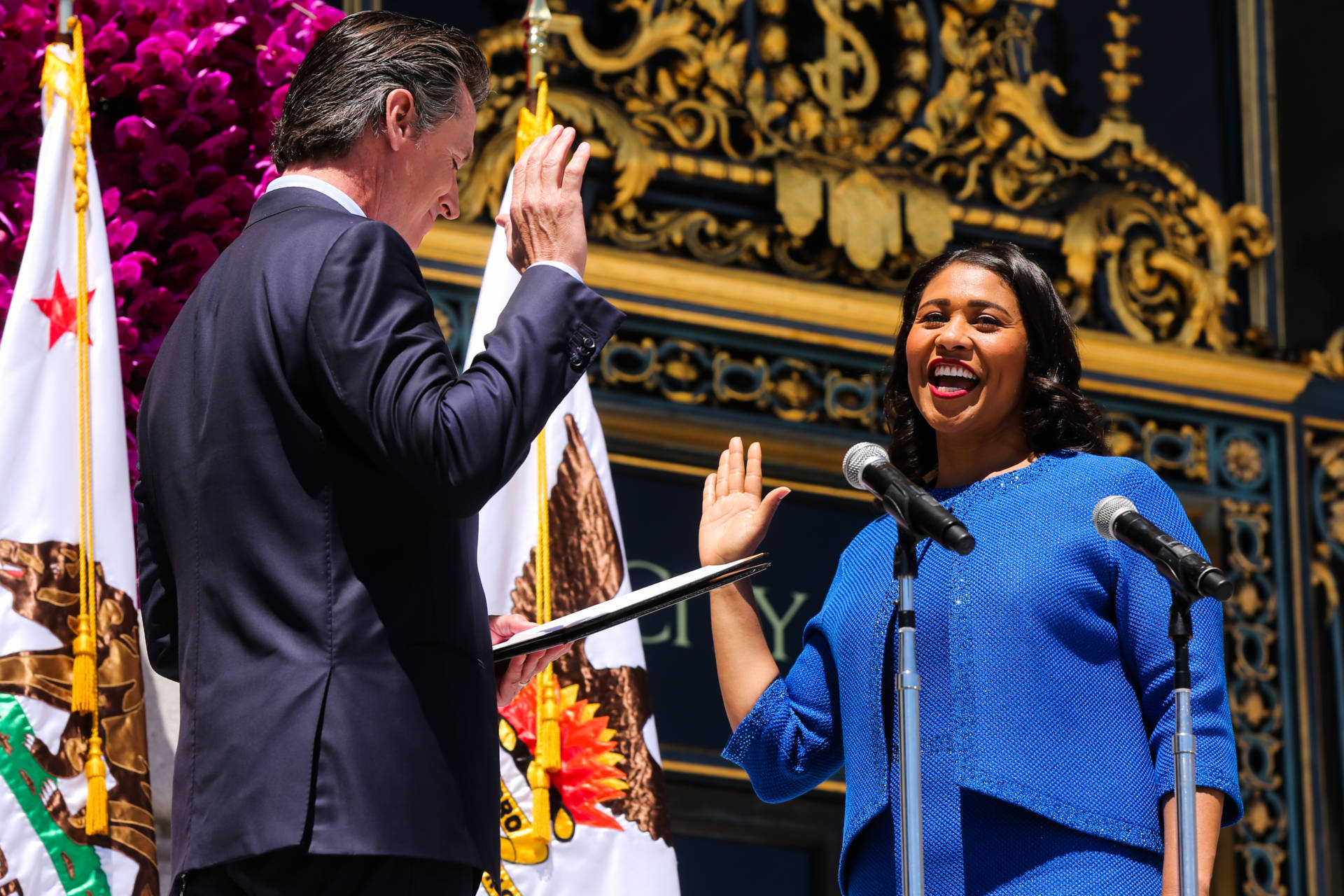 Mayor London Breed takes the oath of office from Lt. Gov. Gavin Newsom during the inauguration ceremony outside City Hall in San Francisco, California, on Wednesday, July 11, 2018. San Francisco Chronicle Pool Photo