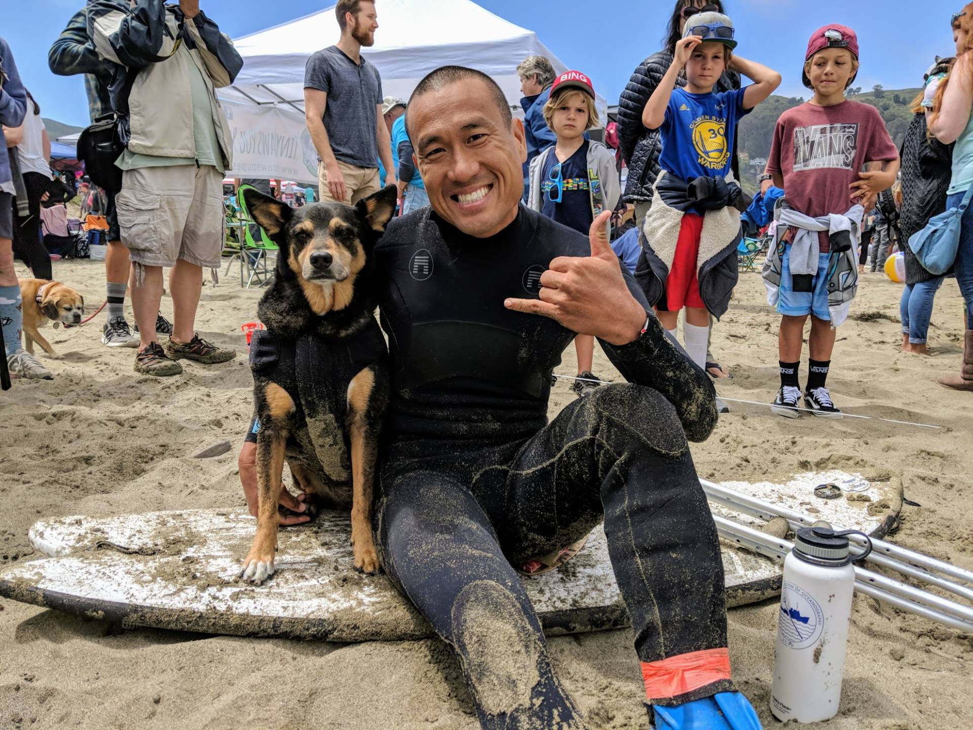 Michael Uy and his dog Abbie Girl are here from Santa Monica. Abbie is the returning champ and also has the Guinness World Record for longest wave surfed by a dog - a total of 107 meters. "You can really tell the bond you have with your dog when you go out surfing together." 