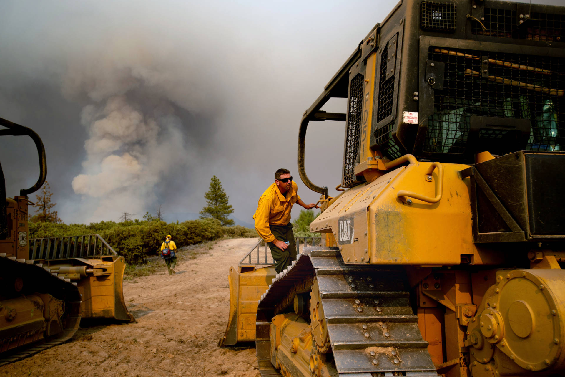 A dozer operator prepares to create a fire break while battling the Ferguson fire in the Stanislaus National Forest, near Yosemite National Park on July 21, 2018. NOAH BERGER/AFP/Getty Images