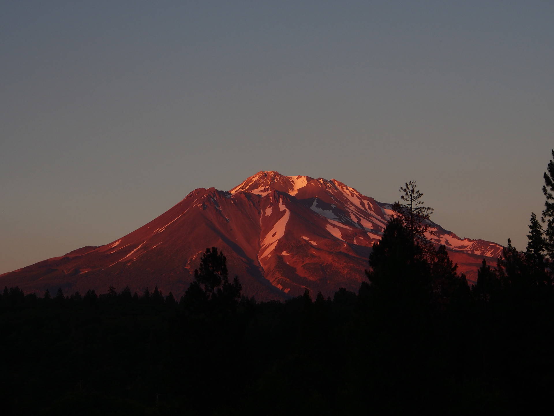 Mt. Shasta is California’s highest volcano, and it towers above the surrounding landscape. Cat Schuknecht/KQED