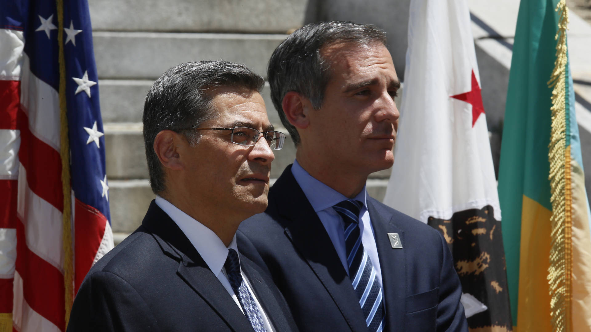 California Attorney General Xavier Becerra (left) and Los Angeles Mayor Eric Garcetti announced the city and county of Los Angeles, plus four other cities, were joining California's lawsuit over the 2020 census citizenship question in May. Damian Dovarganes/AP