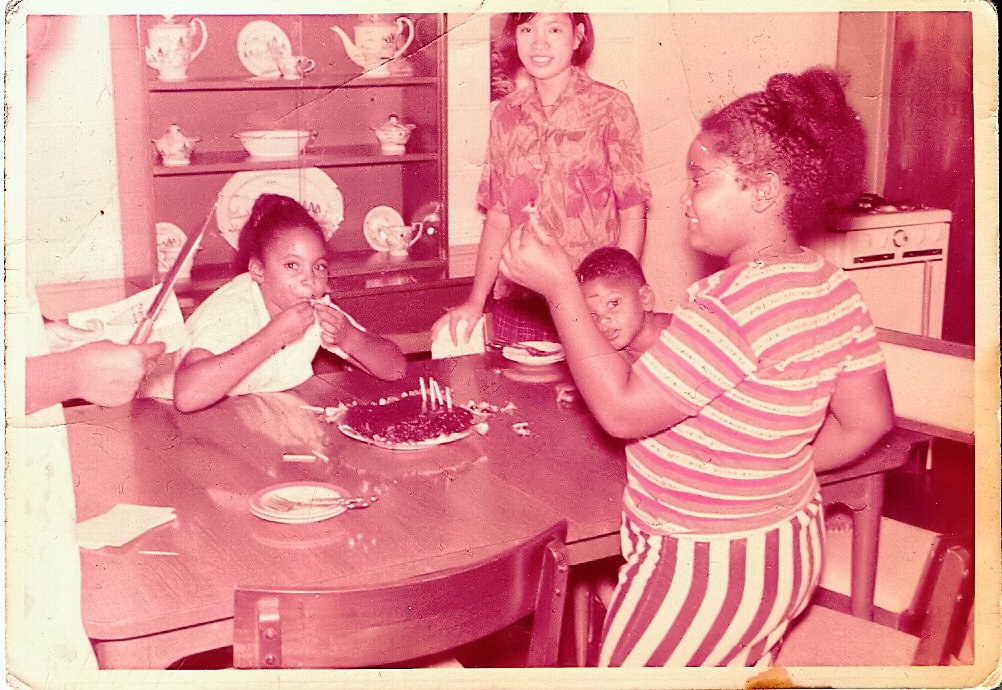 Angela Shortt (right), with her sister Tamara, brother Ricky and their babysitter, Audrey, in their family's home on Clark Air Force Base. Courtesy Angela Shortt