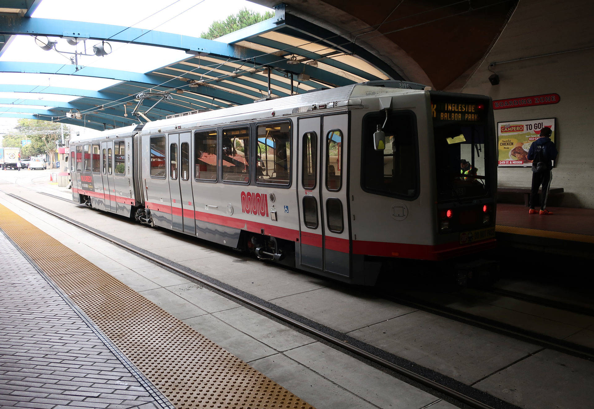 Riders wait to ride a Muni train at the reopened Twin Peaks Tunnel in San Francisco. On Aug. 10, a worker with Shimmick Construction was killed by a falling steel beam while working on the tunnel project. Michelle Wiley/KQED