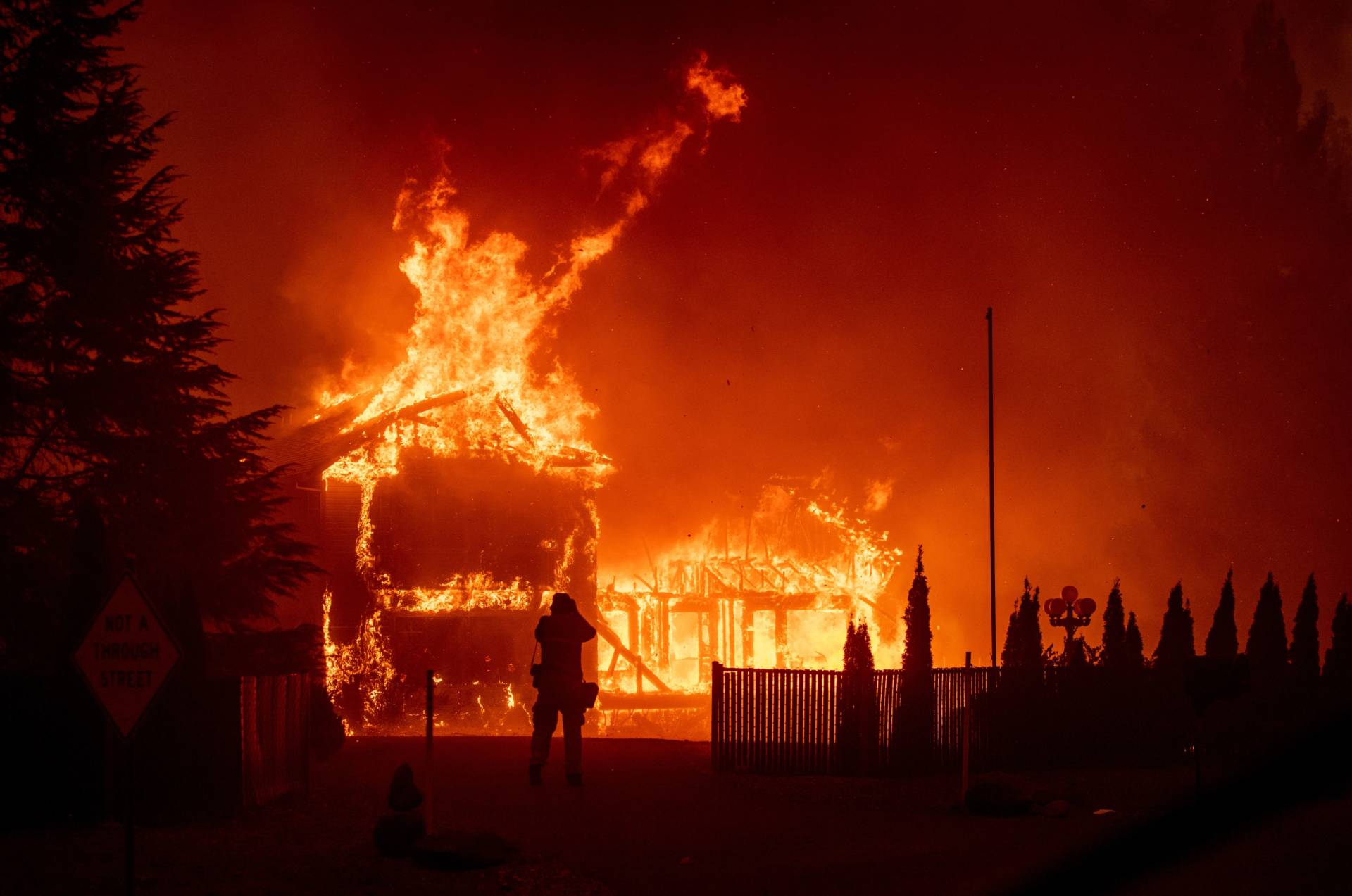 A home burns during the Camp Fire in Paradise, California on Nov. 8, 2018. Josh Edelson/AFP/Getty Images