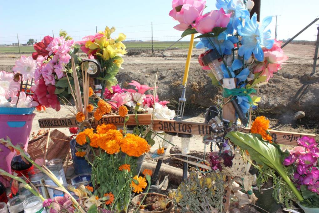 A shrine sits next to a Delano road where Marcelina and Santos Garcia died in a car crash while fleeing U.S. Immigration and Customs Enforcement agents. Susan Ferriss / Center for Public Integrity