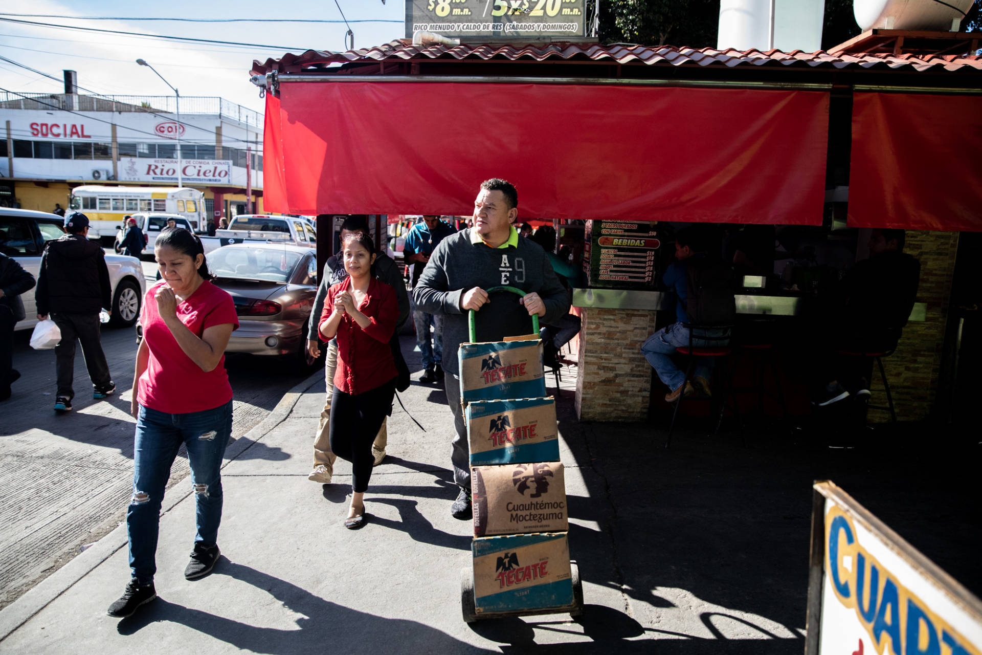 José Aguilar heads to the store on a supply run in Tijuana, Mexico. His restaurant Honduras 504 has become a community center for Honduran legal residents and unauthorized migrants alike. Tomás Ayuso for NPR